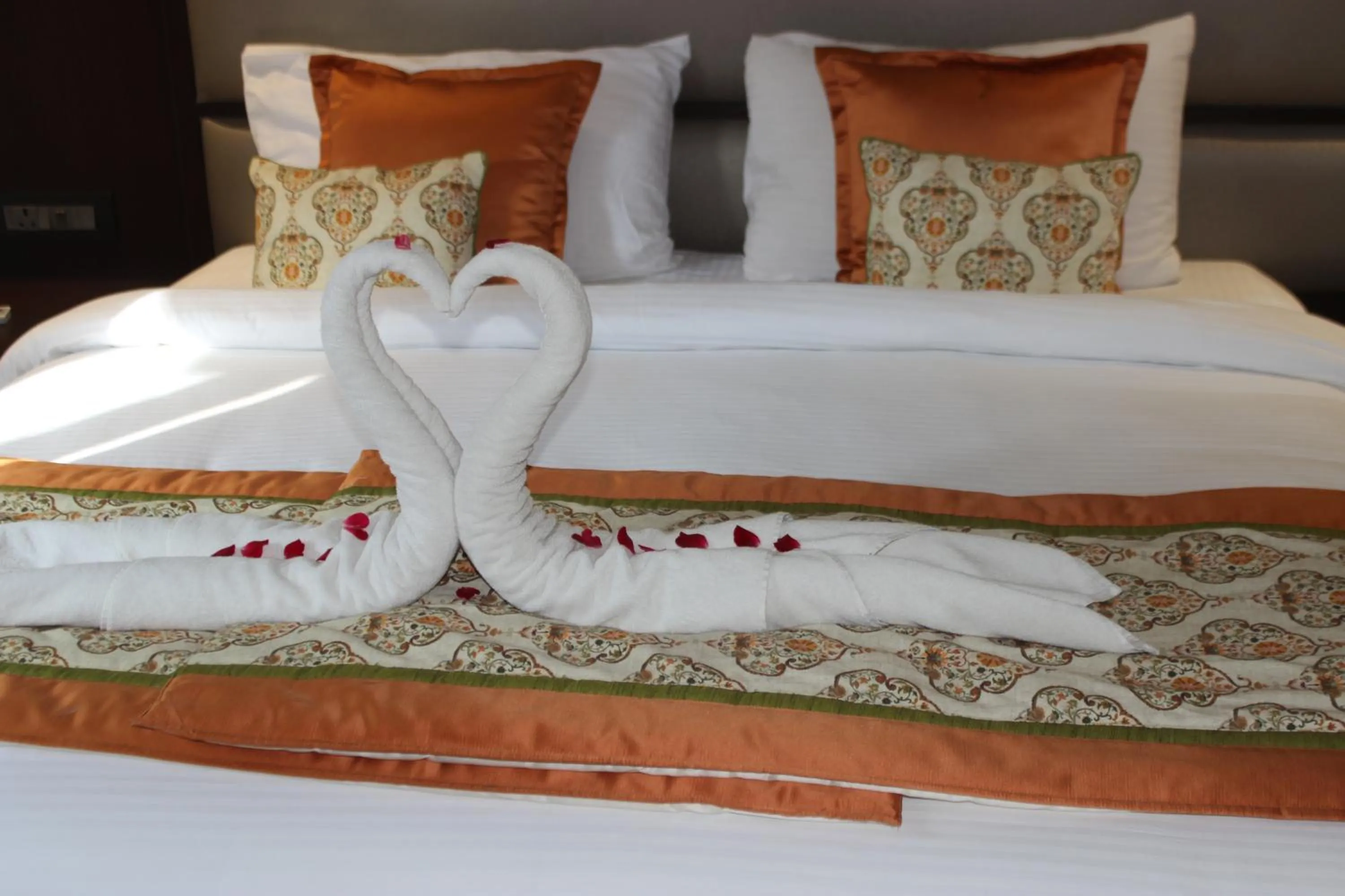Bed in Ramya Resort & Spa