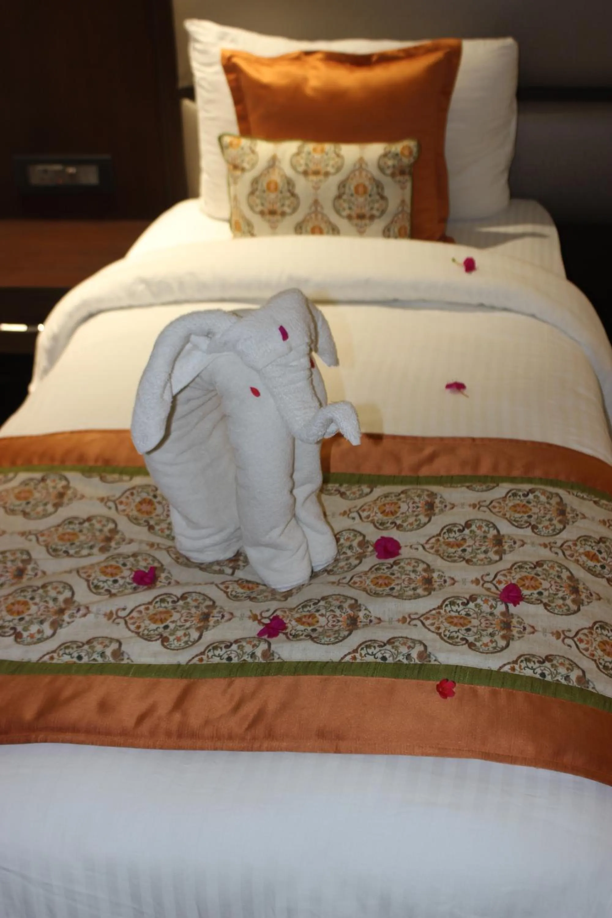 Bed in Ramya Resort & Spa