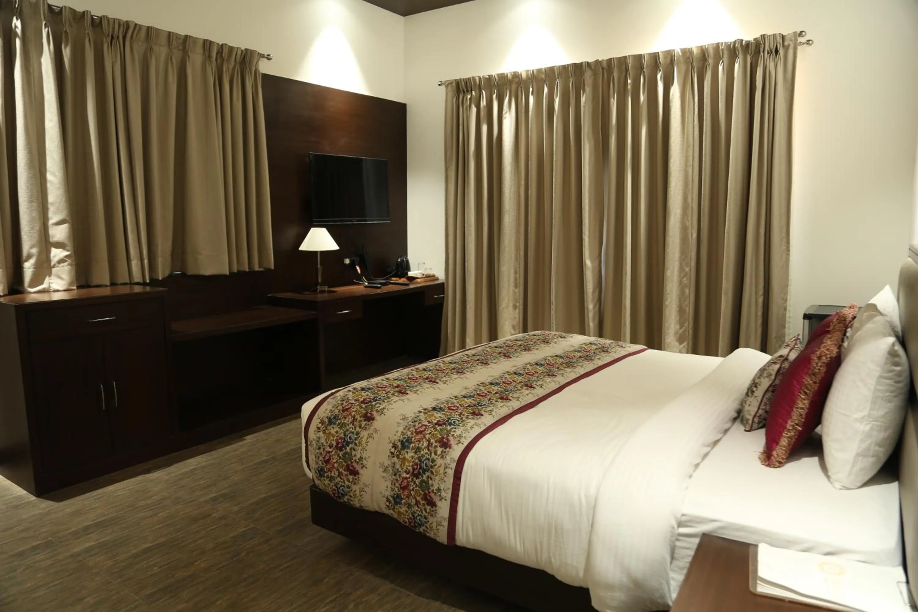 Bed in Ramya Resort & Spa