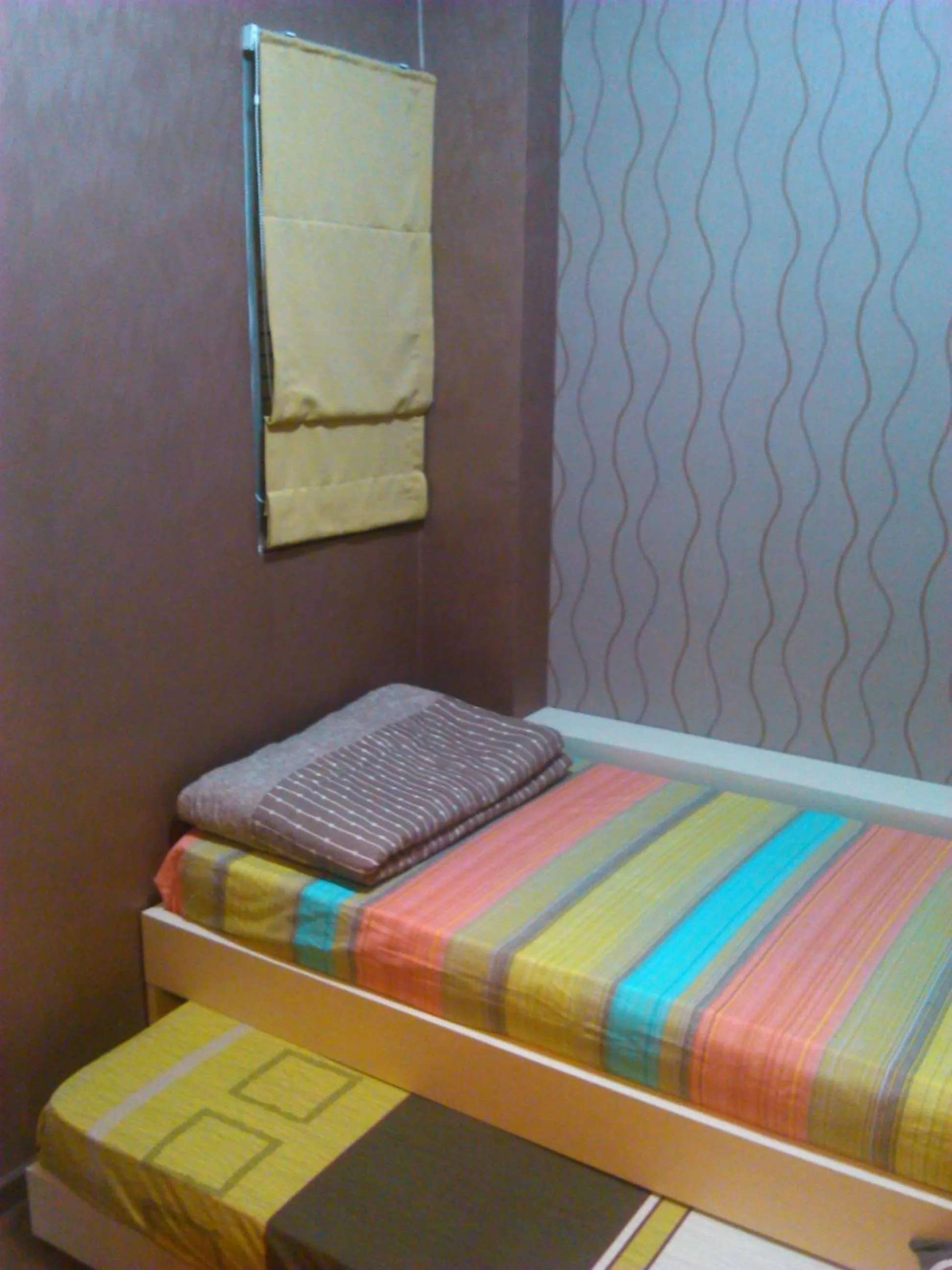 Bed in Apartment The Suites Metro by Yudis