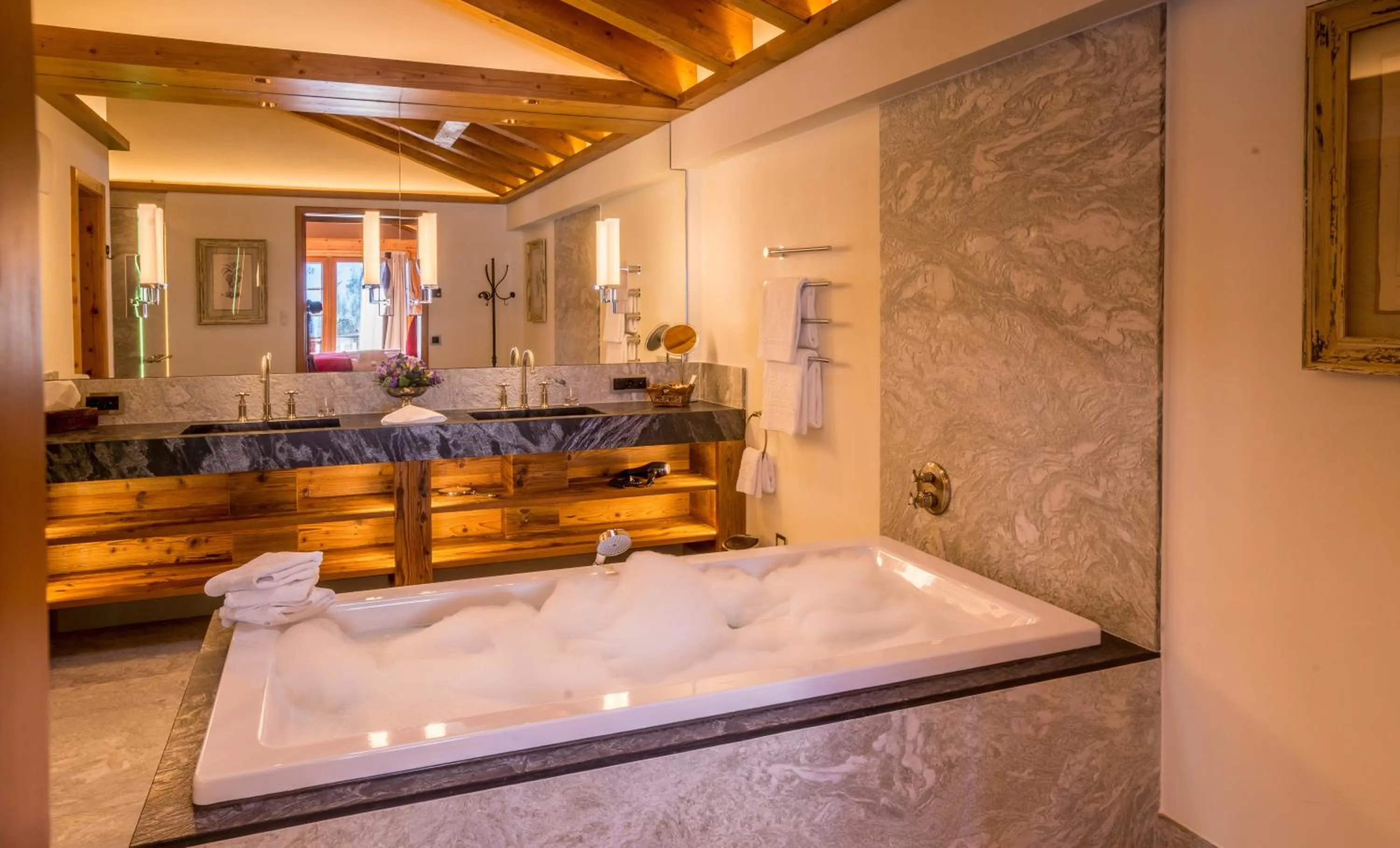 Bathroom, Bed in Riffelalp Resort 2222m Ski-in & Ski-out