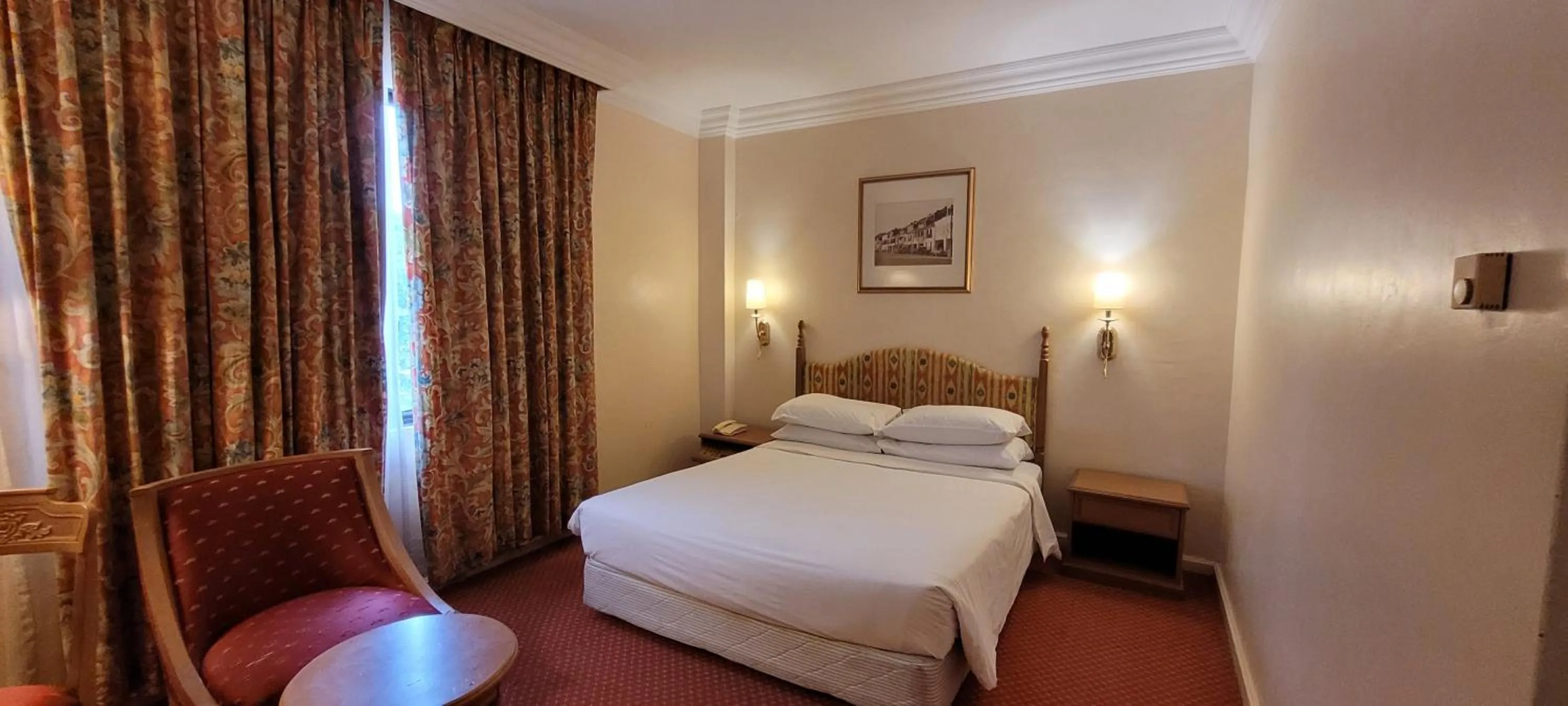 Bed in Merdeka Palace Hotel & Suites