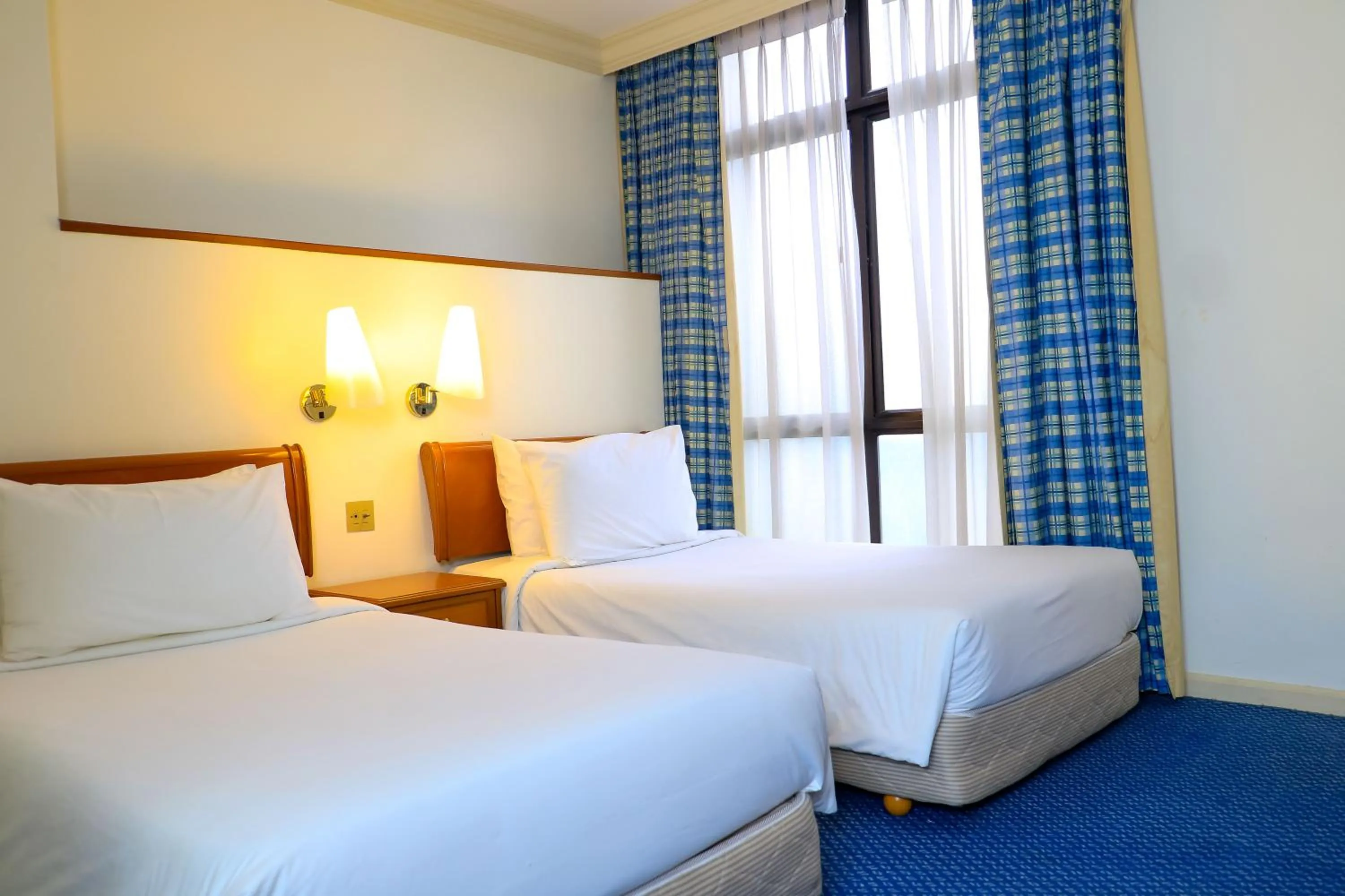 Property building, Bed in Merdeka Palace Hotel & Suites