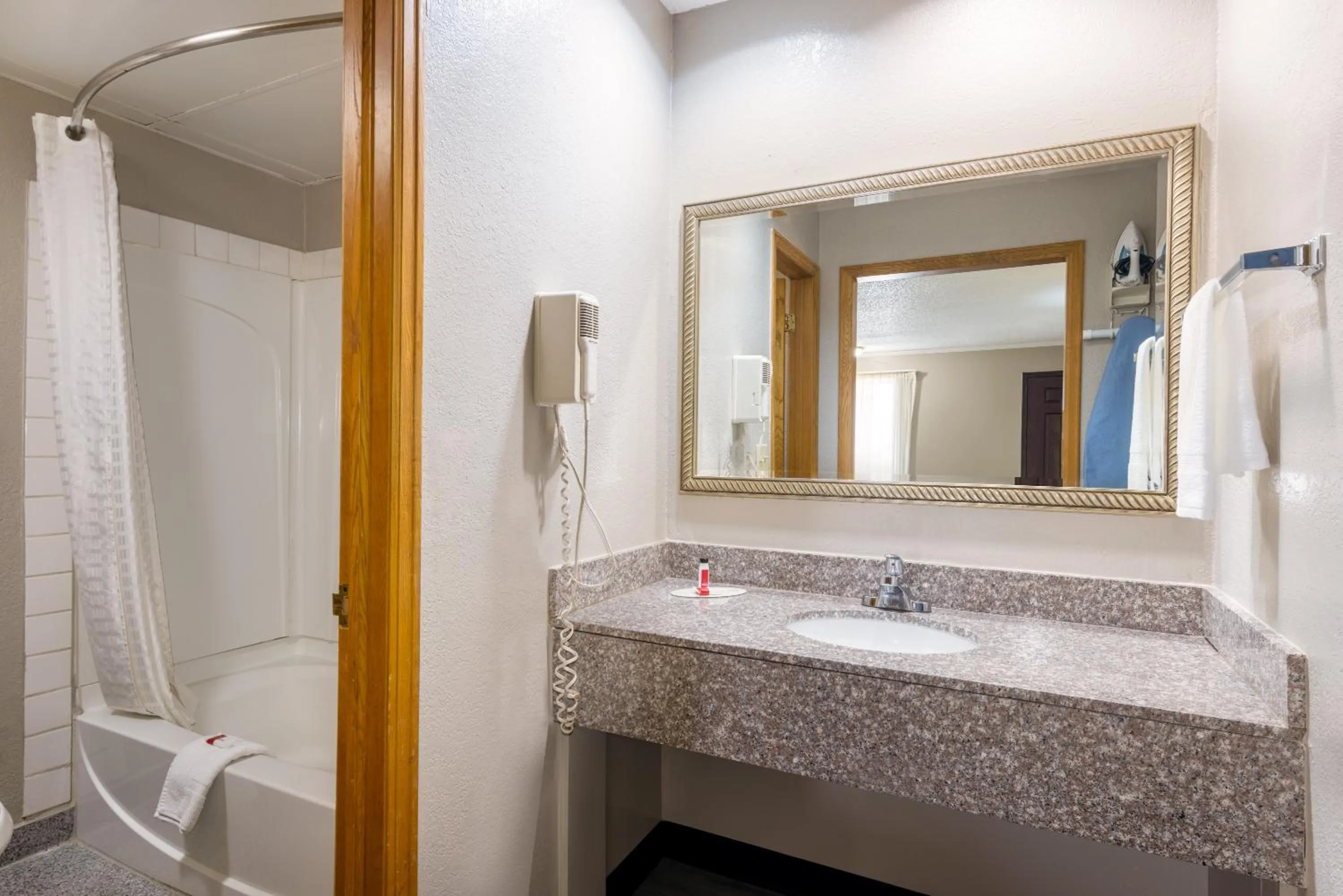 Bathroom in Super 8 by Wyndham Kansas City at Barry Road/Airport