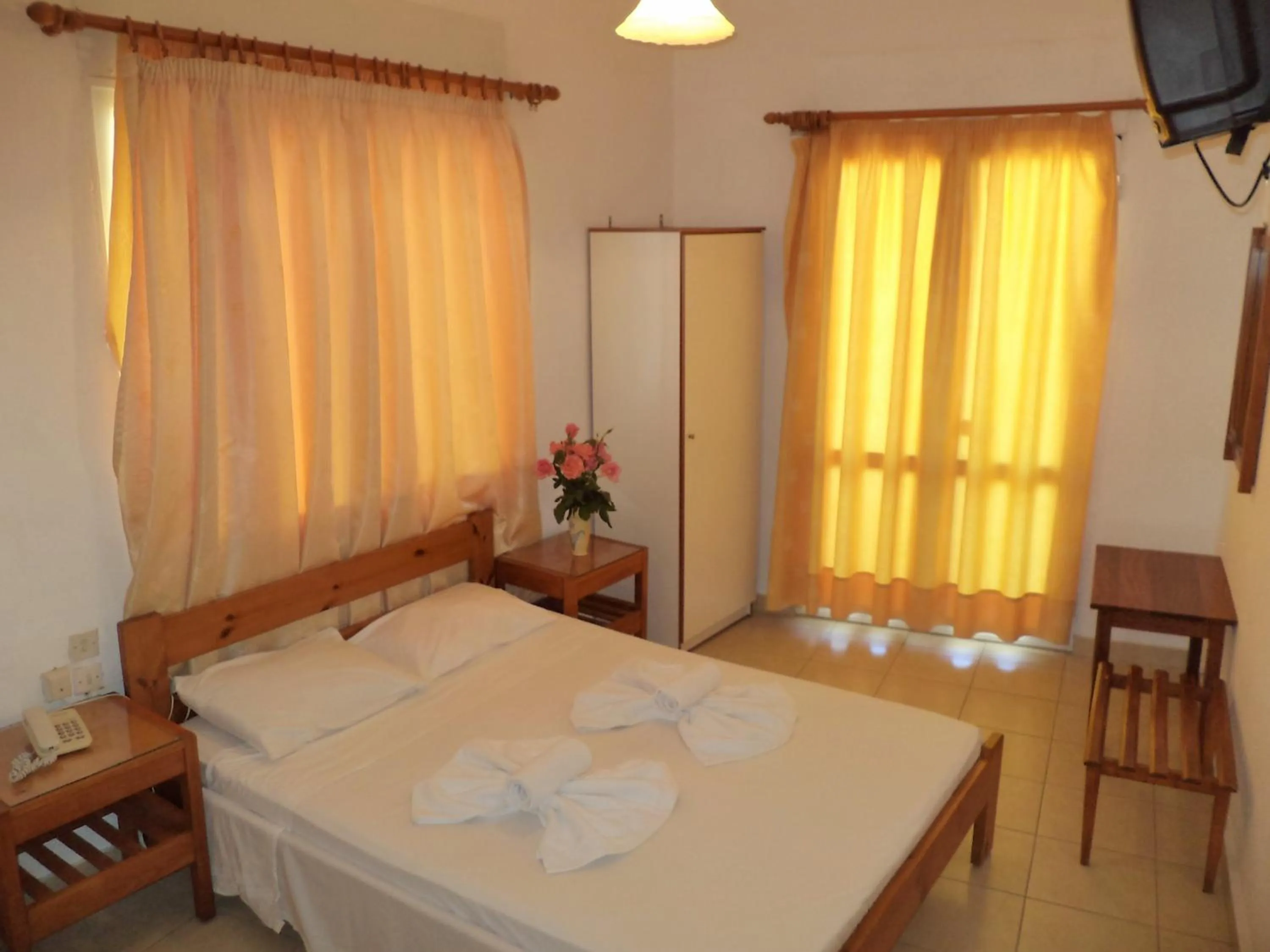 Bed in Poseidon Hotel