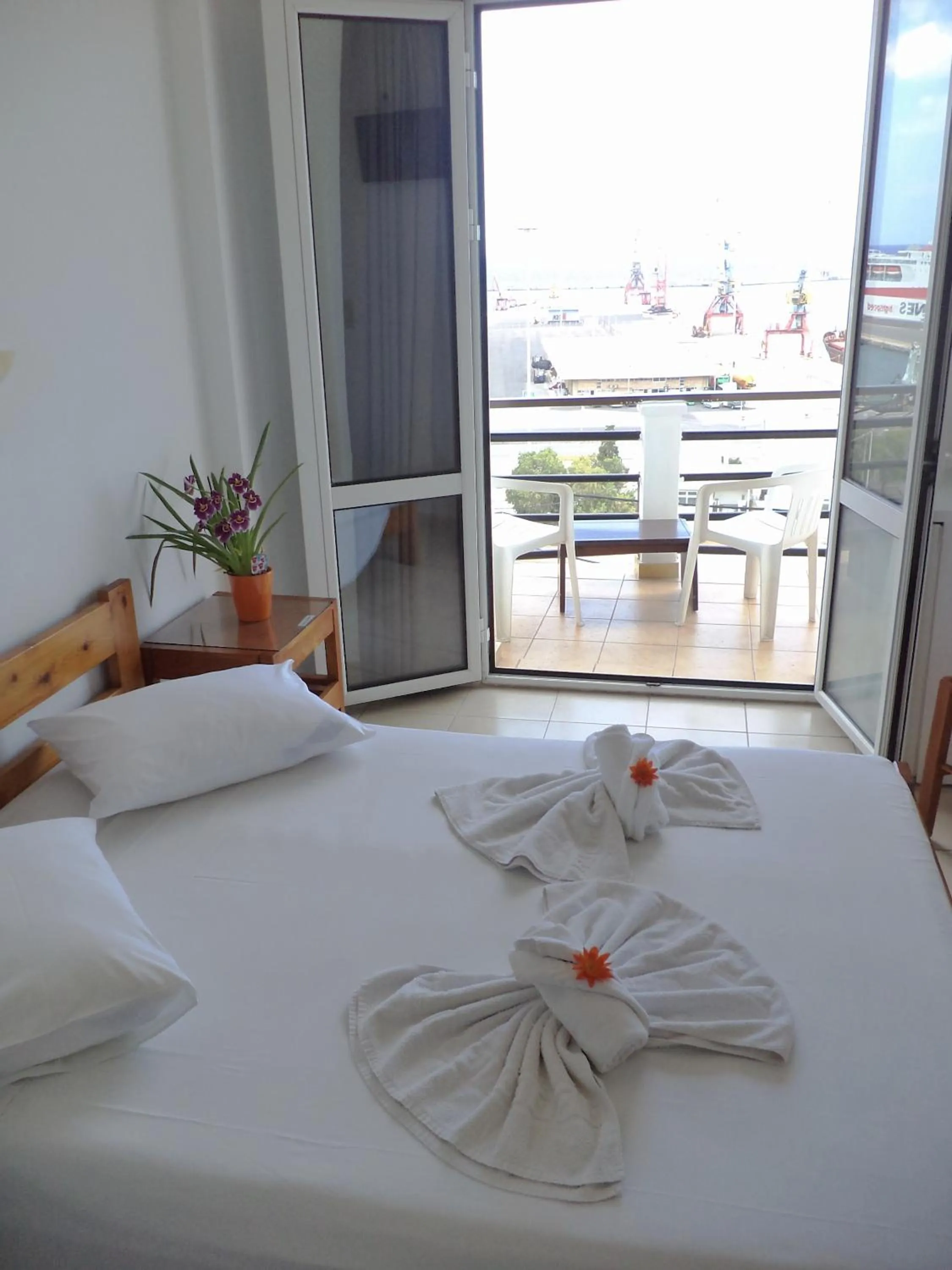 Bed in Poseidon Hotel