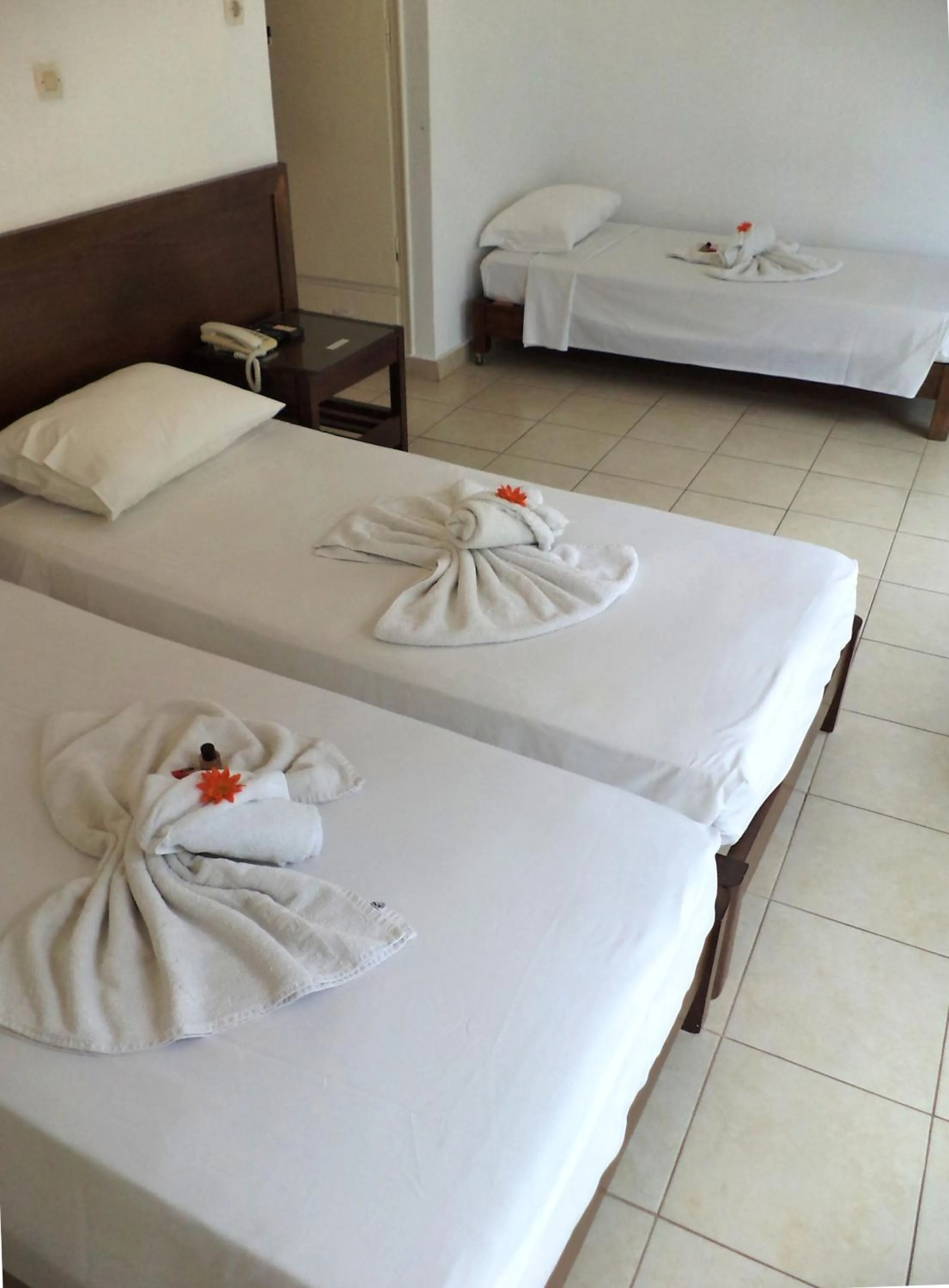 Bed in Poseidon Hotel