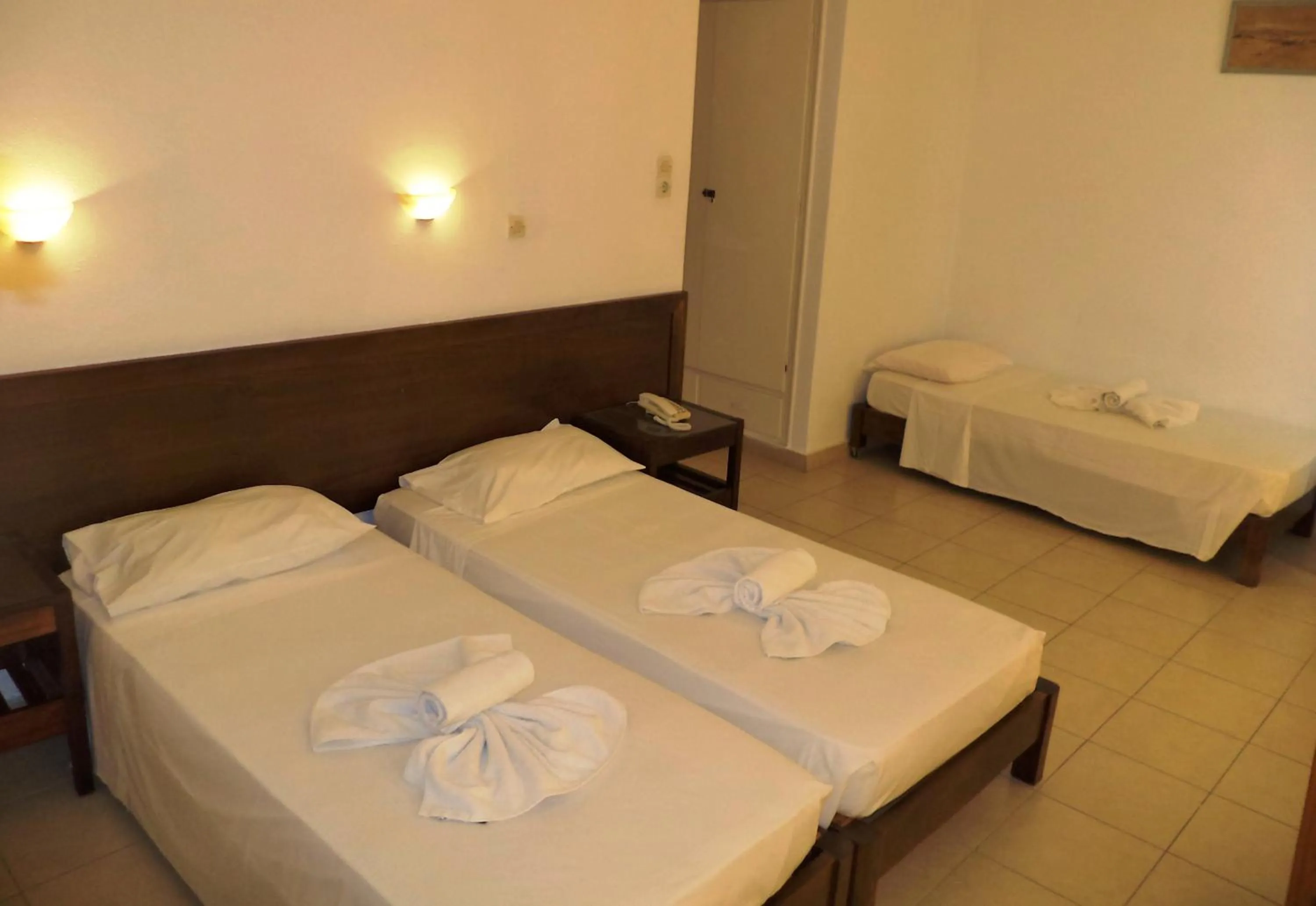 Bed in Poseidon Hotel