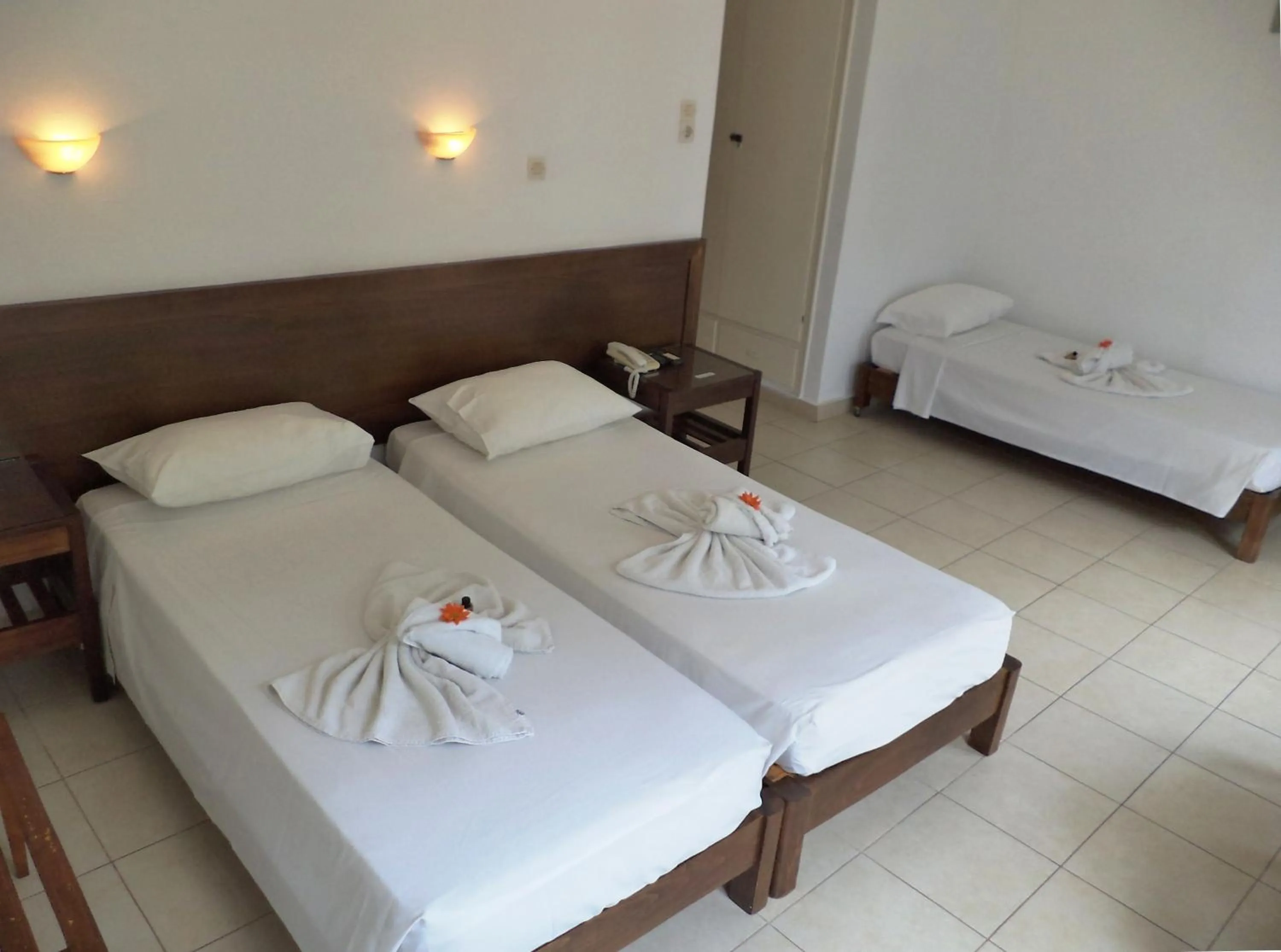 Bed in Poseidon Hotel