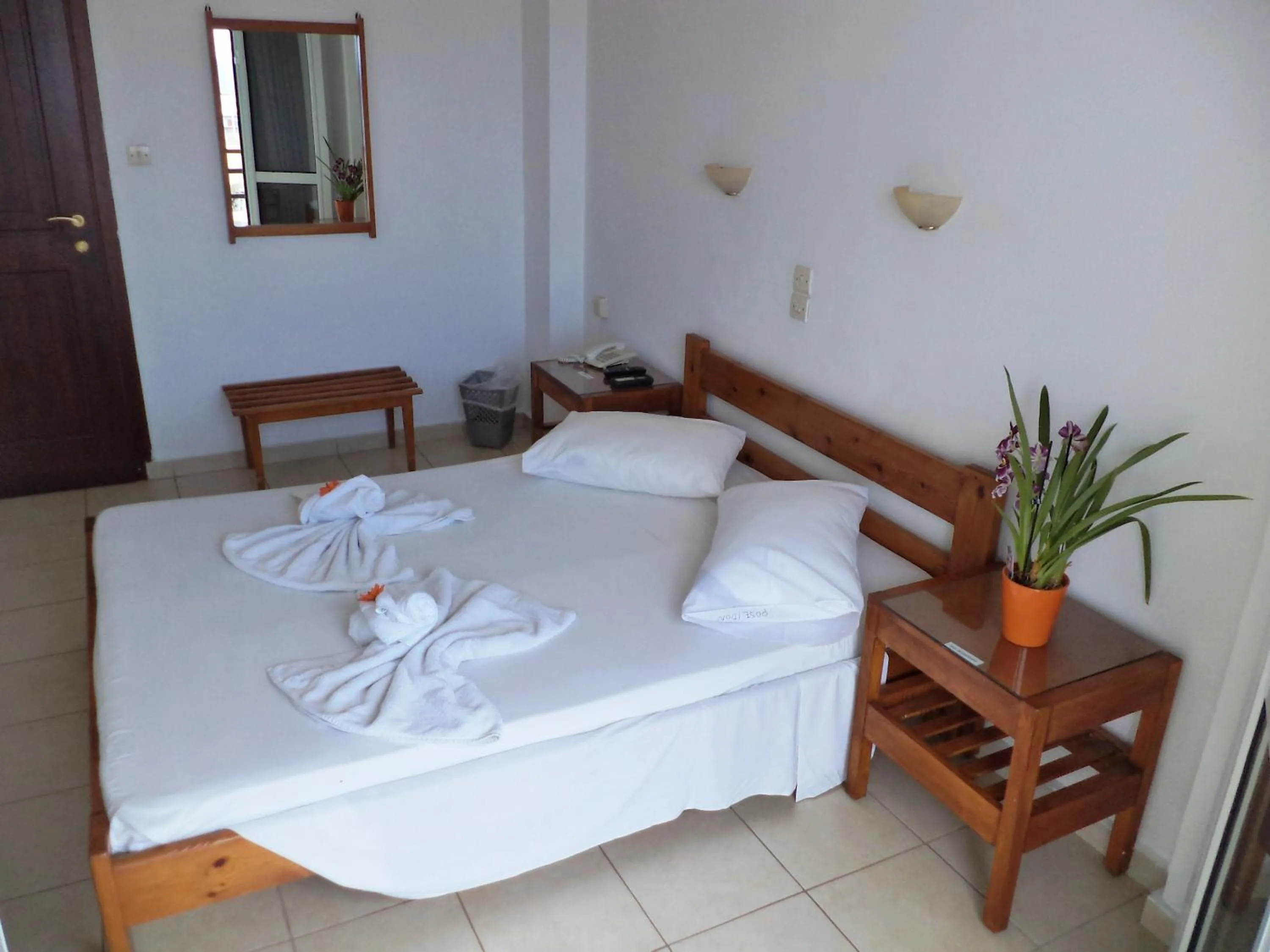 Bed in Poseidon Hotel