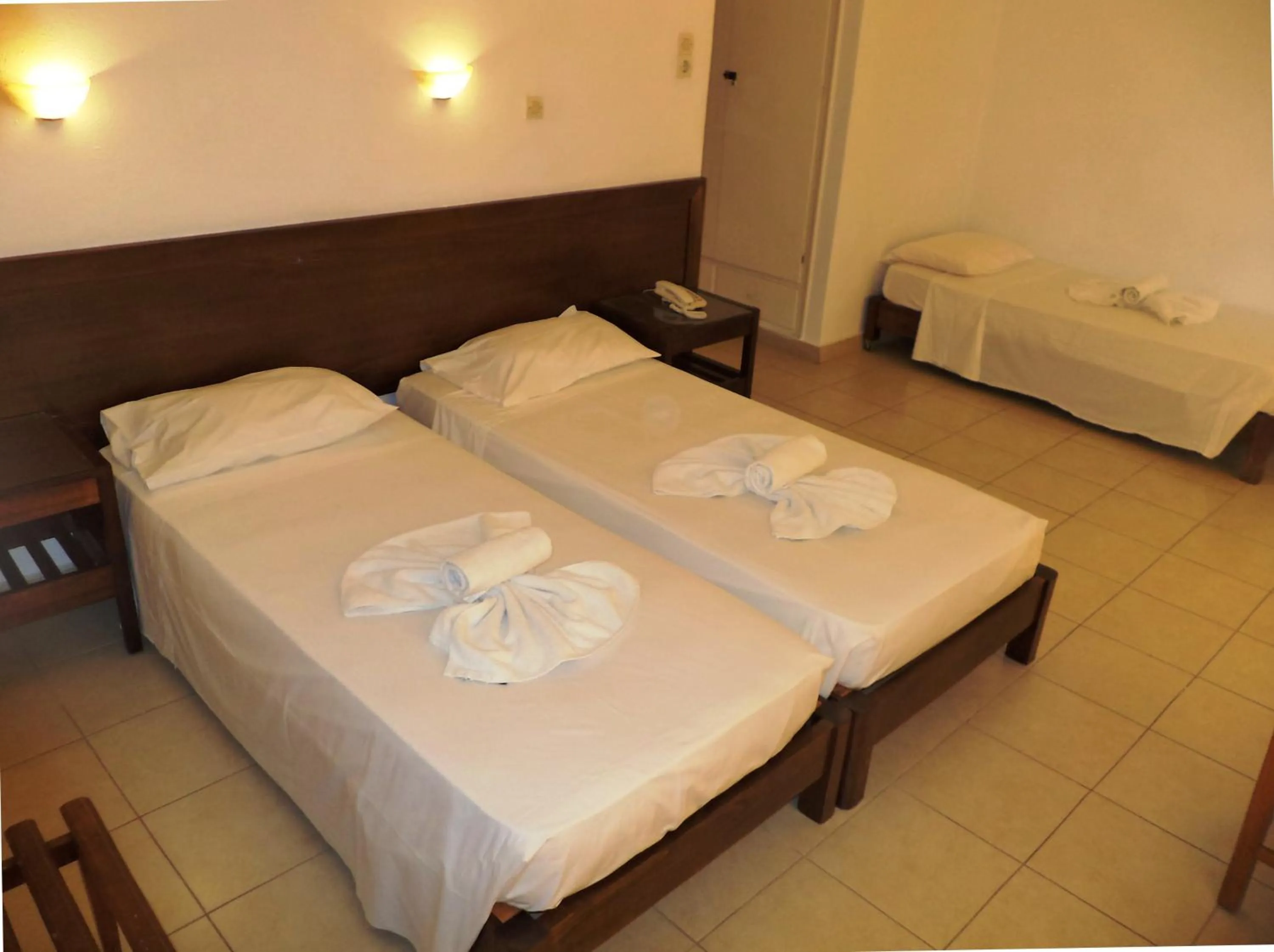 Bed in Poseidon Hotel