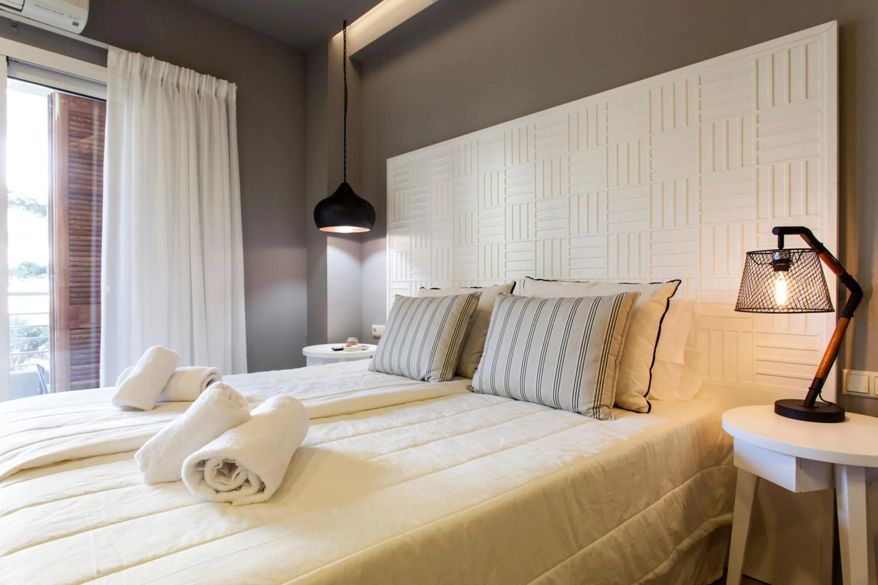 Bed in Candia Studios & Rooms