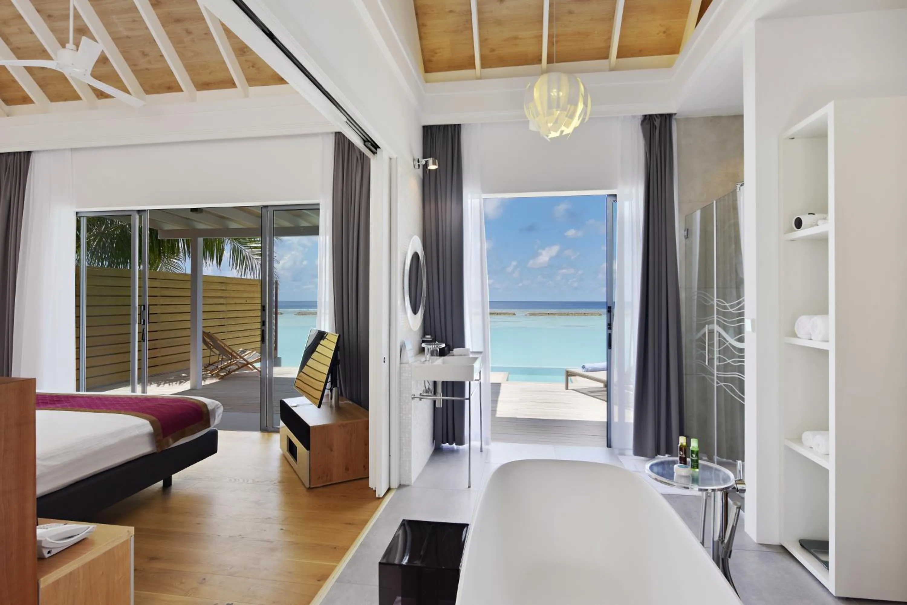 Bathroom, Bed in Kuramathi Maldives