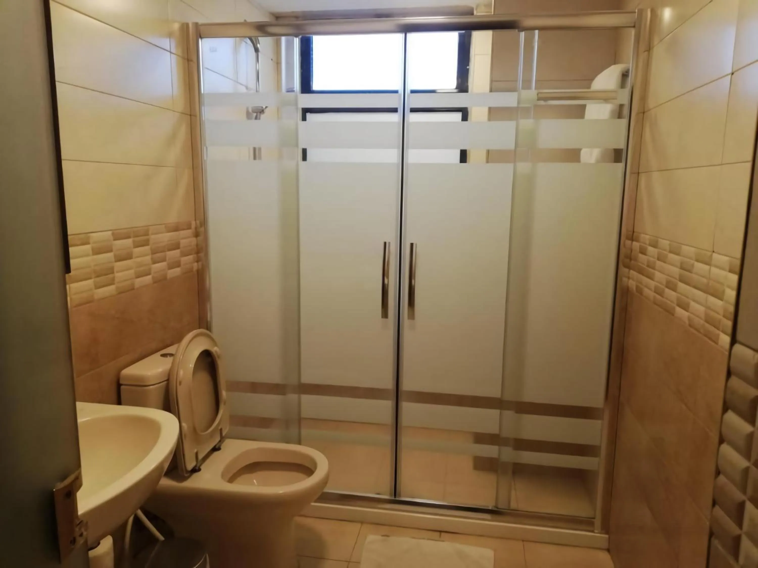 Bathroom in Rozana Hotel