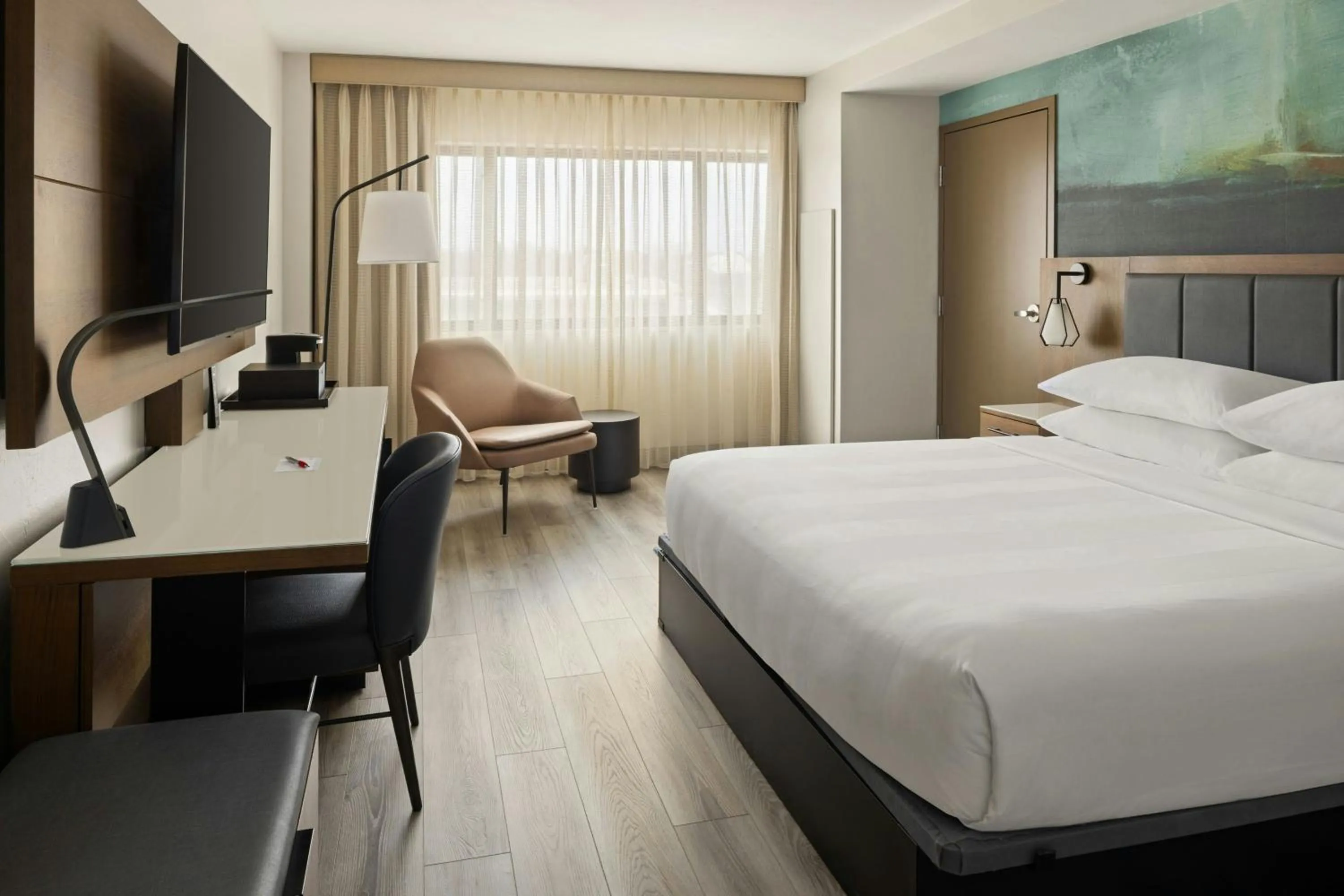 Photo of the whole room, Bed in Oshkosh Marriott Waterfront Hotel & Convention Center