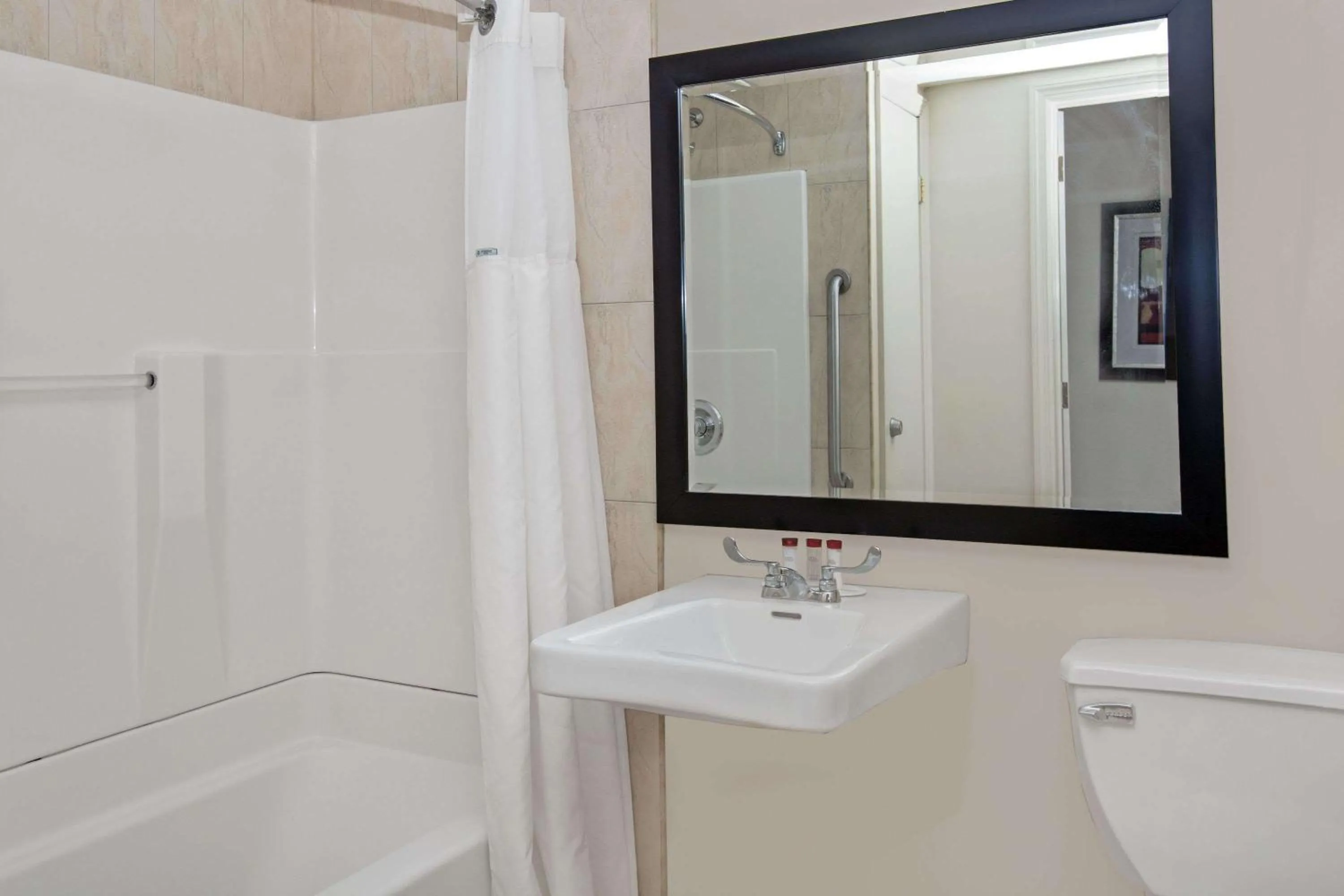 Bathroom in Ramada by Wyndham Staten Island