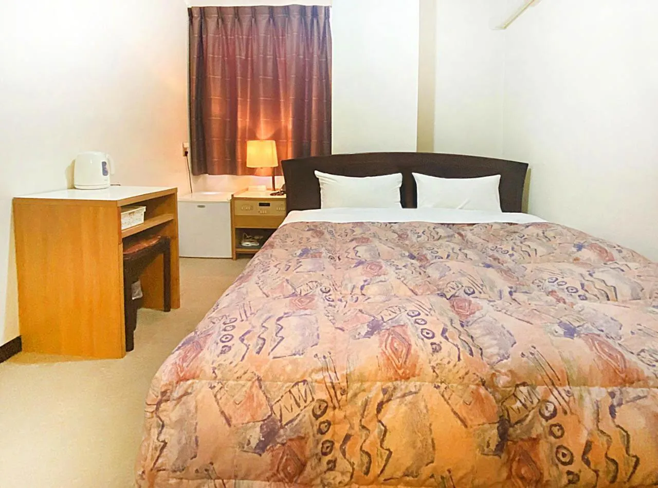 Photo of the whole room, Bed in Hotel Okuni (Royal Inn Group)