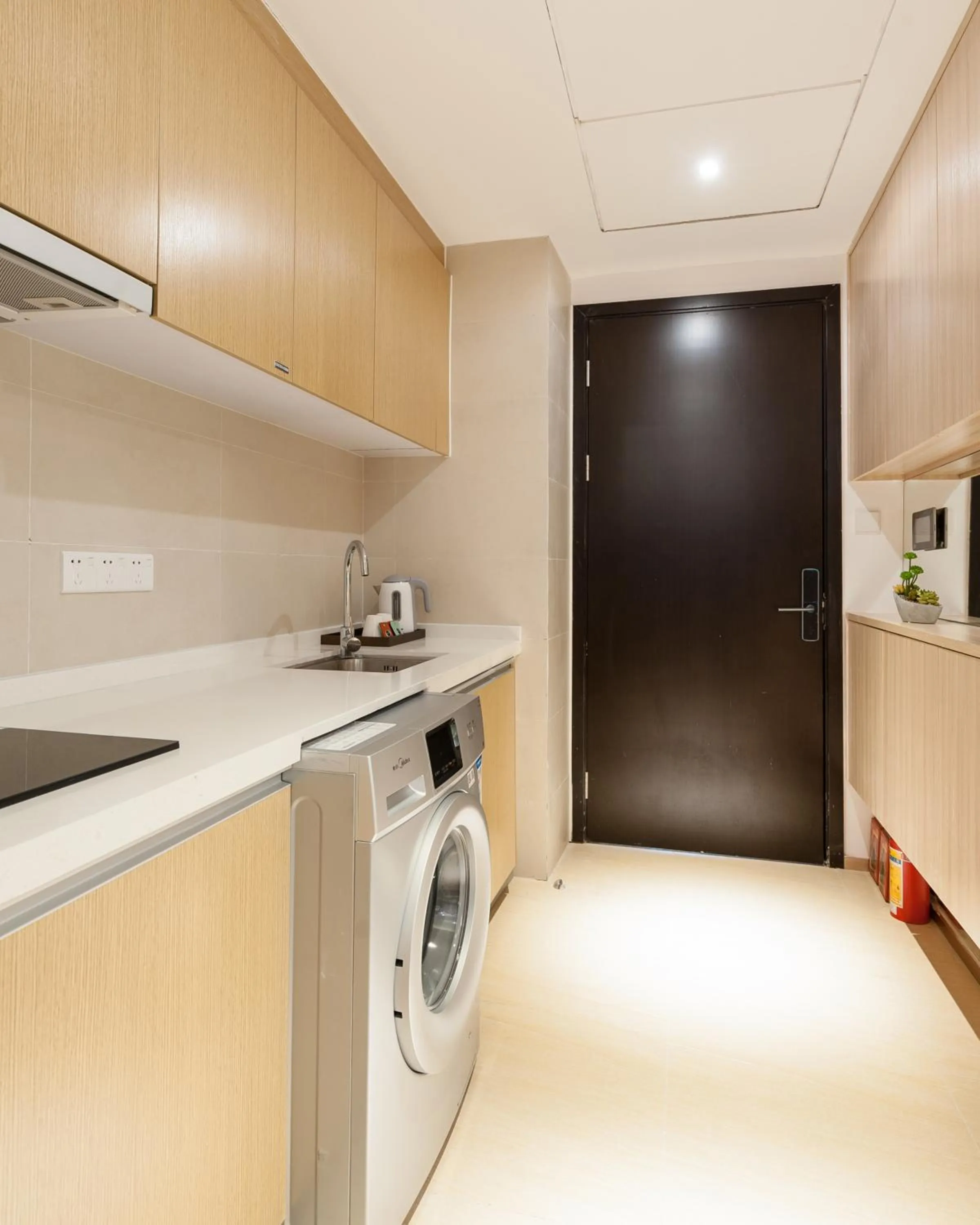 Kitchen or kitchenette in Yumi Huanju Apartment -广州东站 燕塘地铁站店