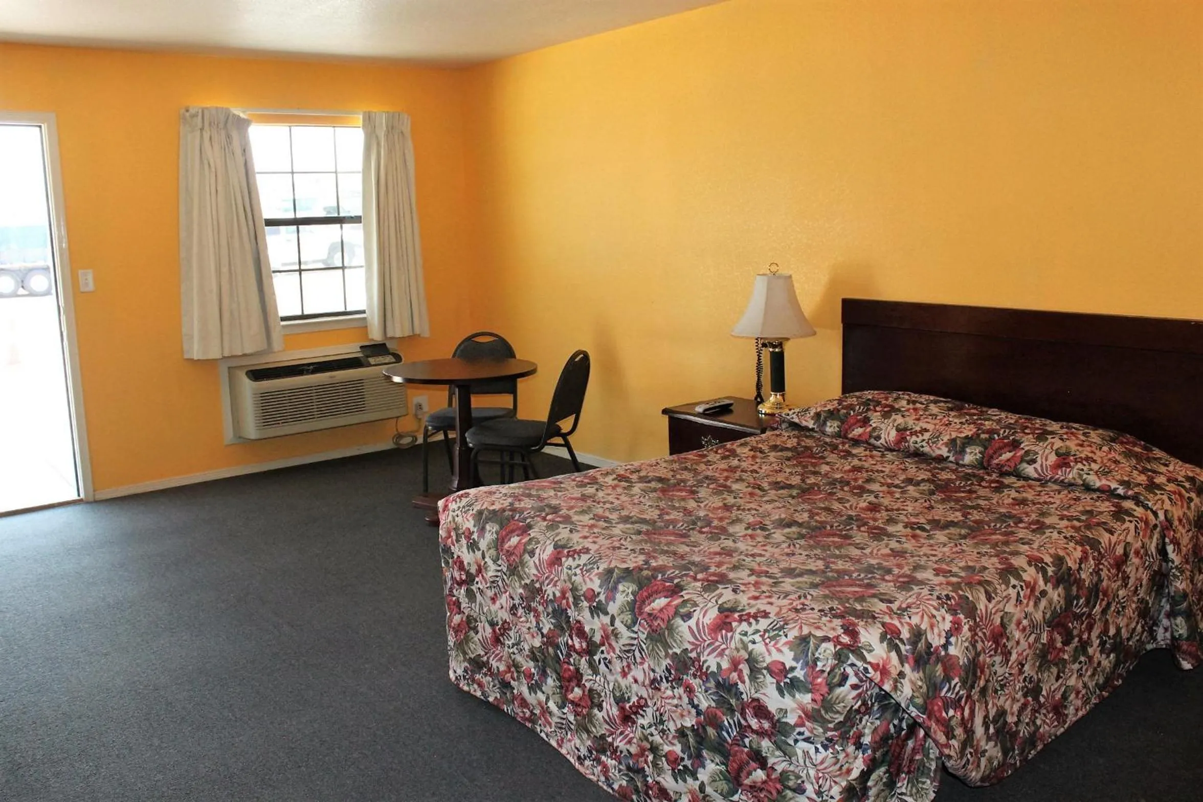 Bed in Adobe Inn Motel