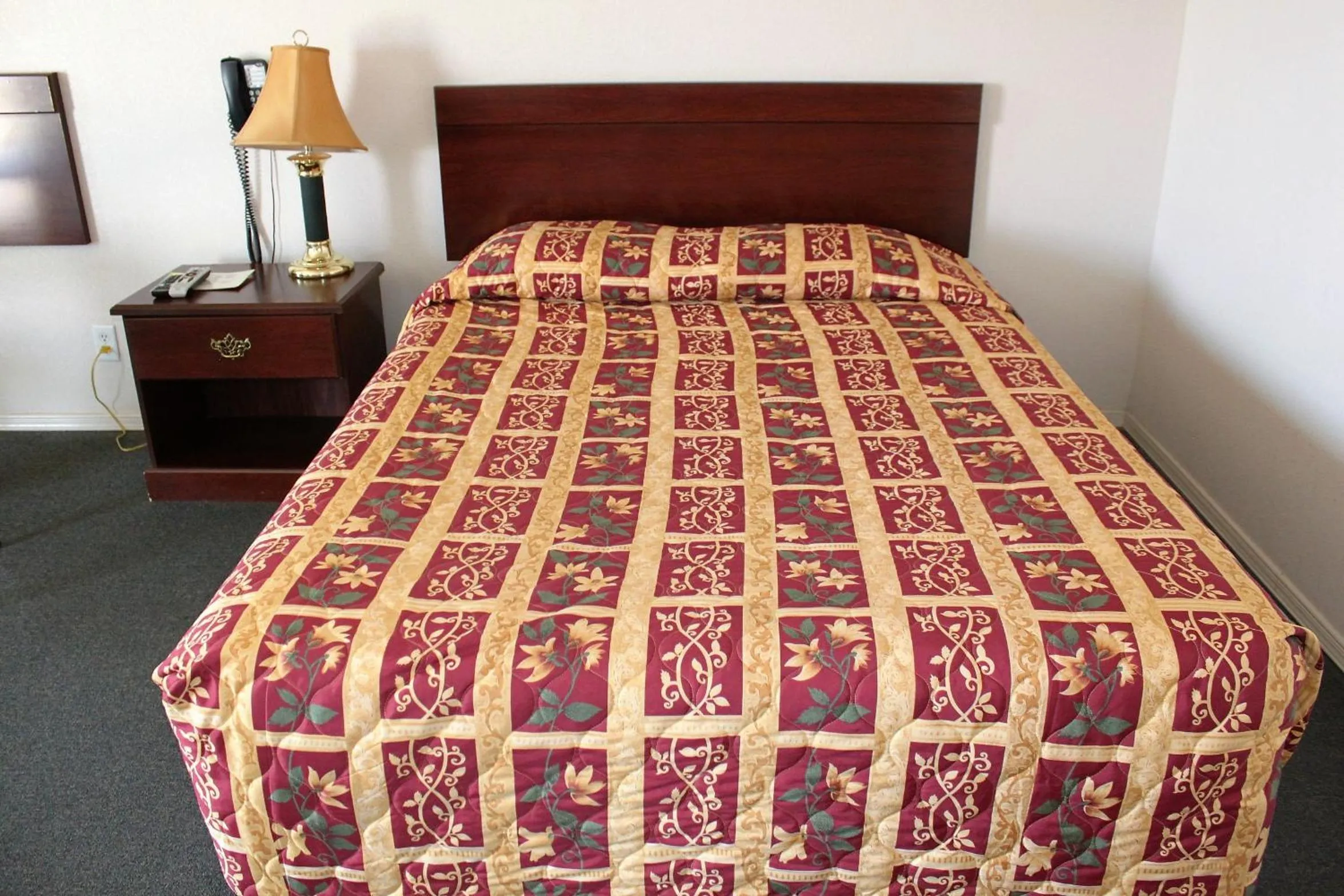 Bed in Adobe Inn Motel