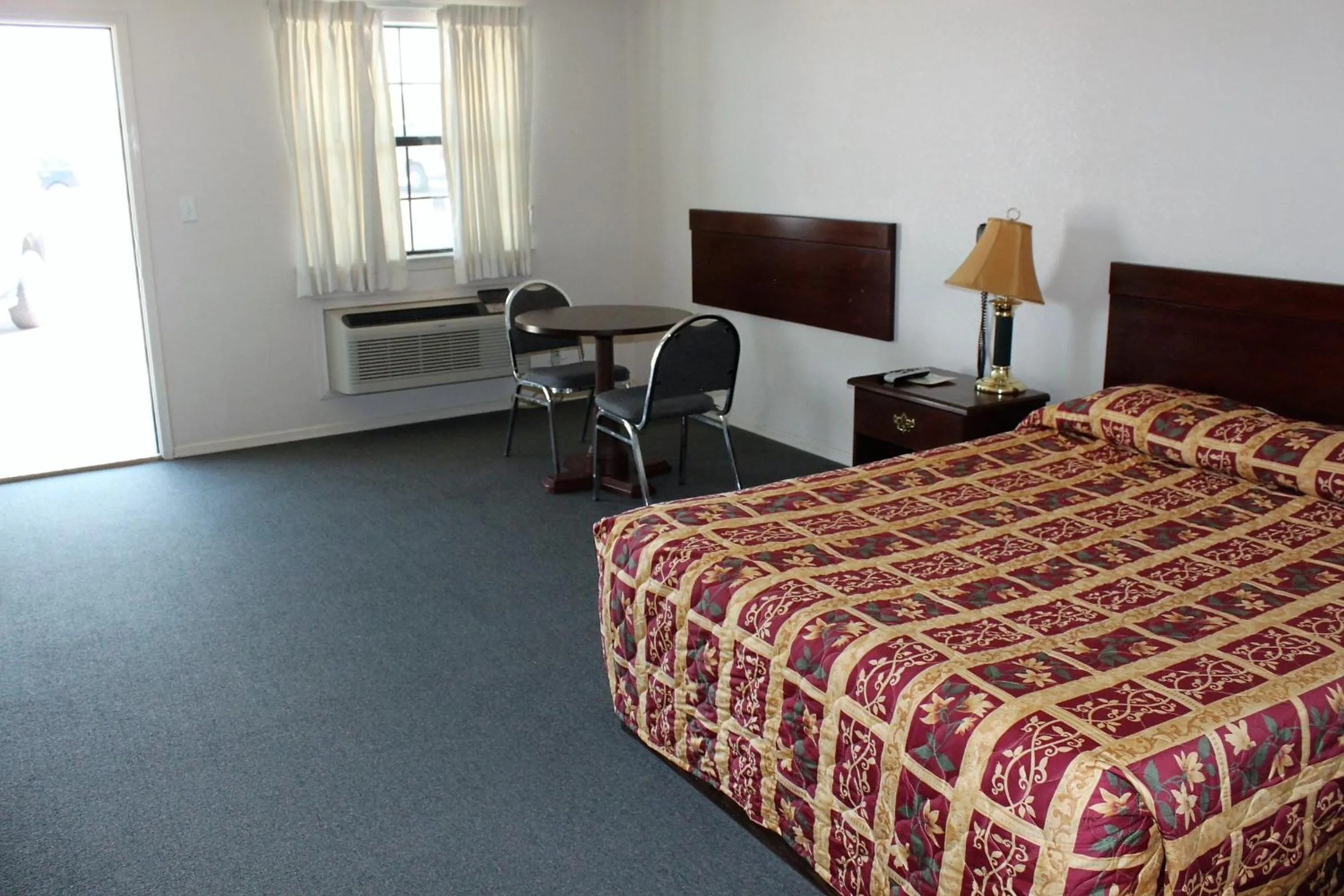 Bed in Adobe Inn Motel