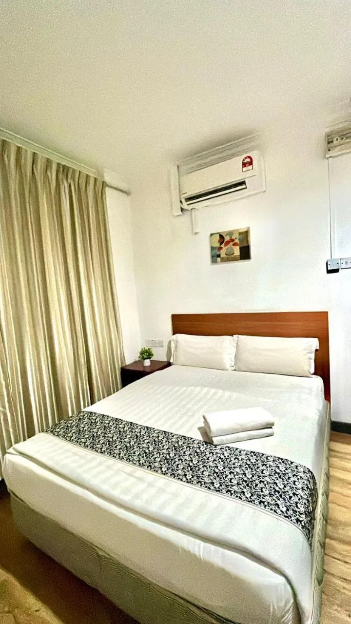 Bed in Switz Paradise Hotel