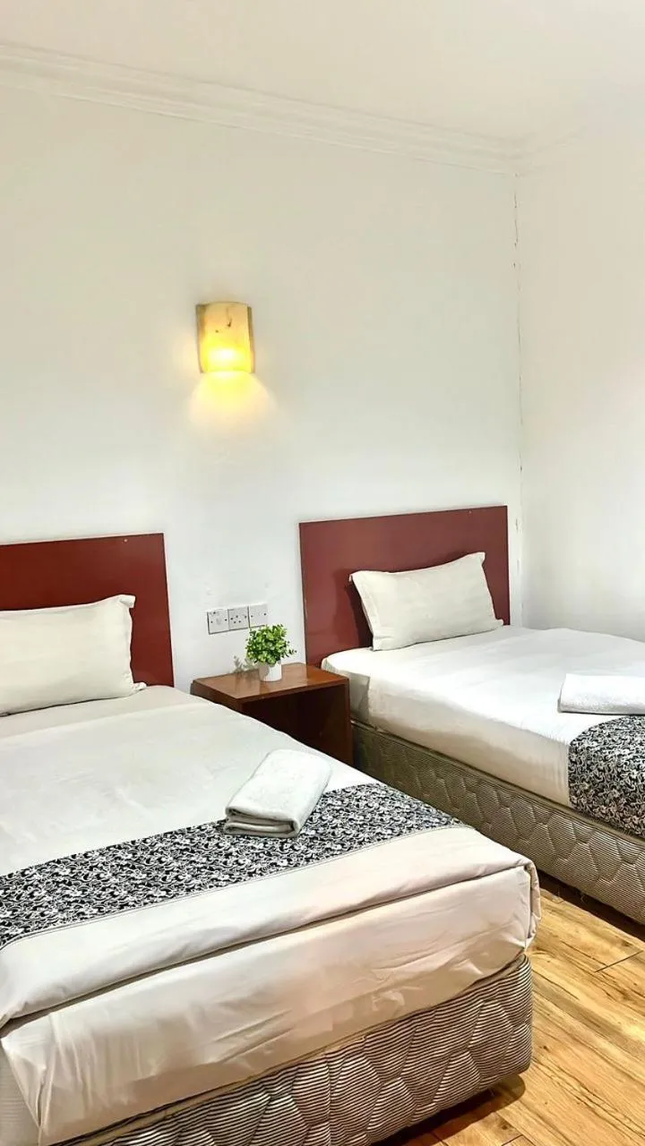 Bed in Switz Paradise Hotel