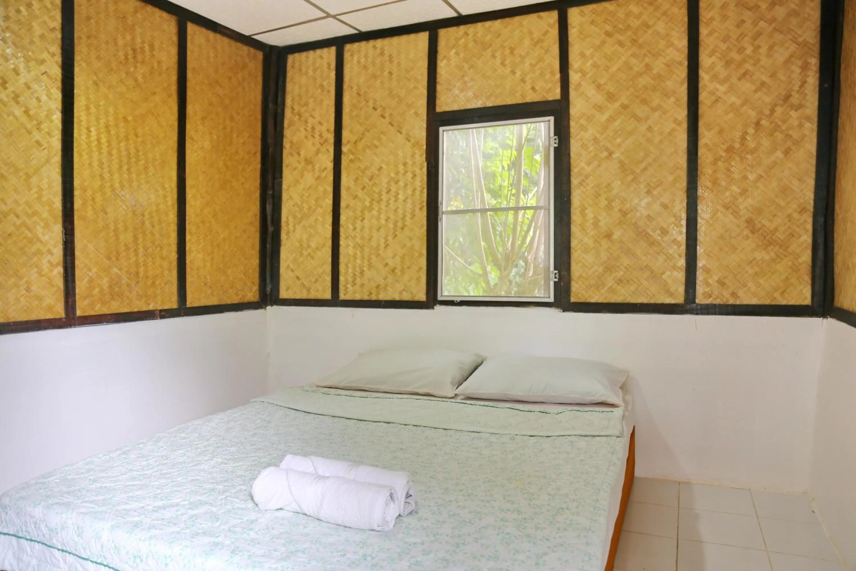 Bed in TP Hut Bungalows