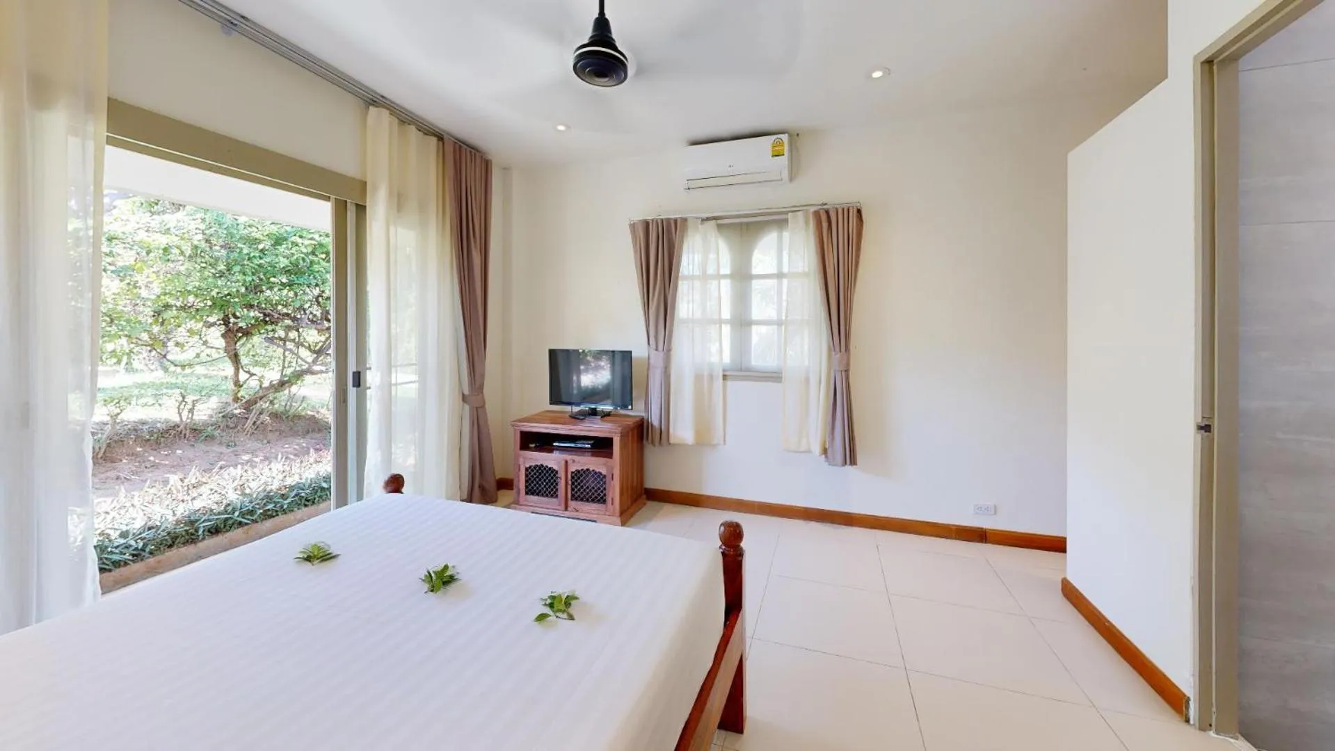Bed in Idyllic Samui Beach Villa Resort