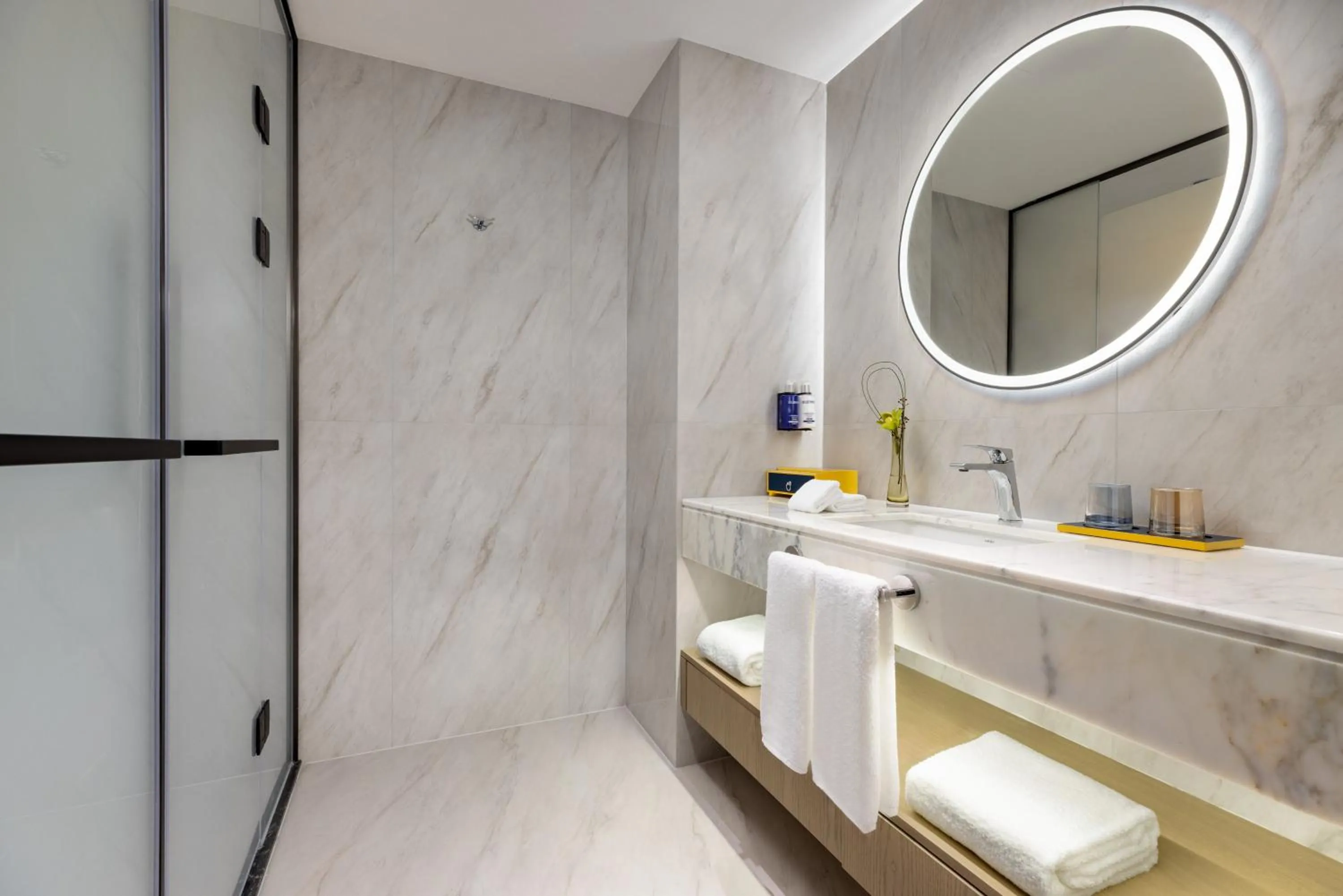 Bathroom in voco Suzhou Guanqian Street by IHG