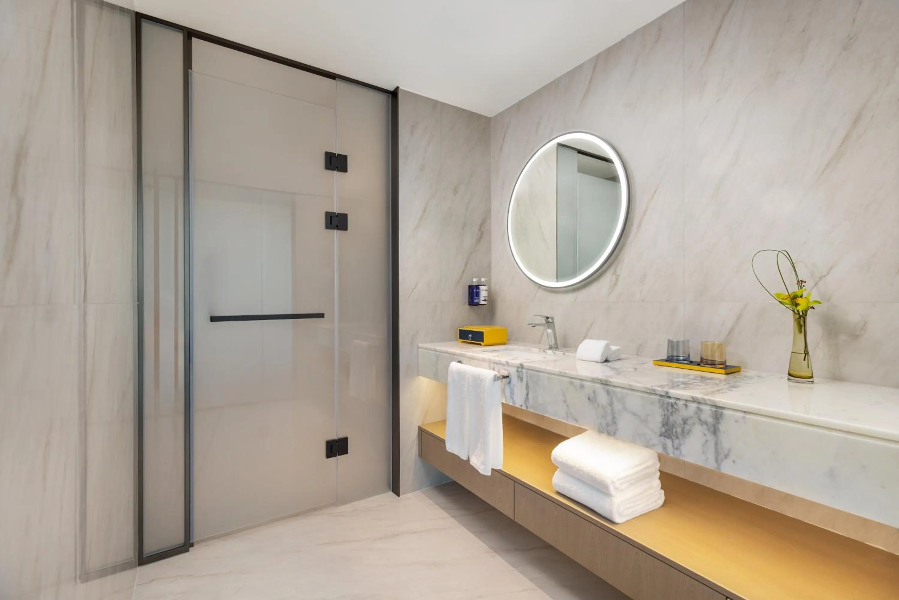 Bathroom in voco Suzhou Guanqian Street by IHG