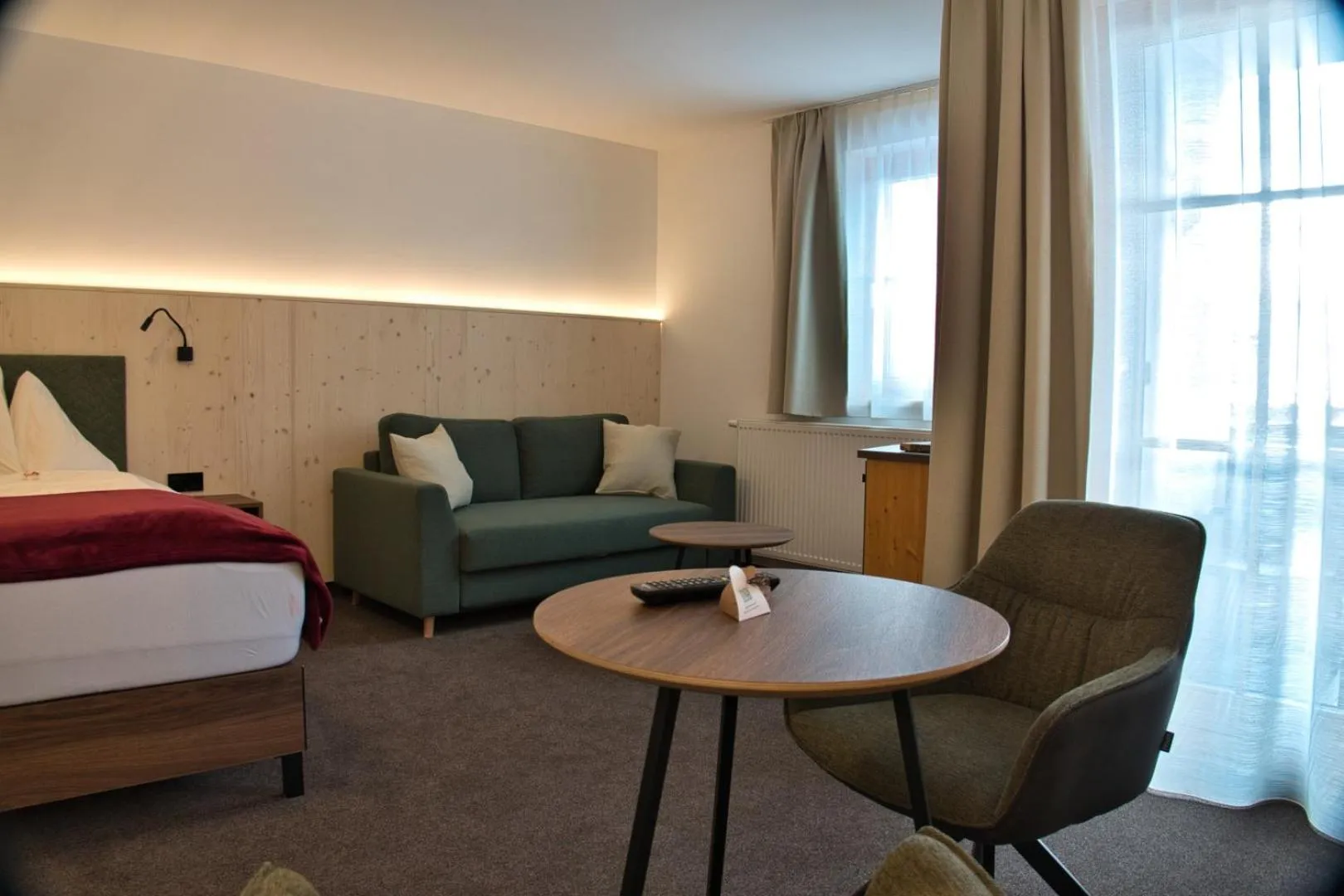 Seating area, Bed in Hotel Malteinerhof