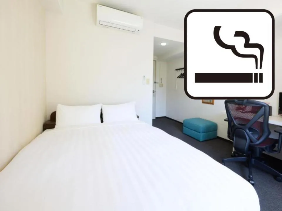 Bed in Tabist HotelArflex Tokuyama Station