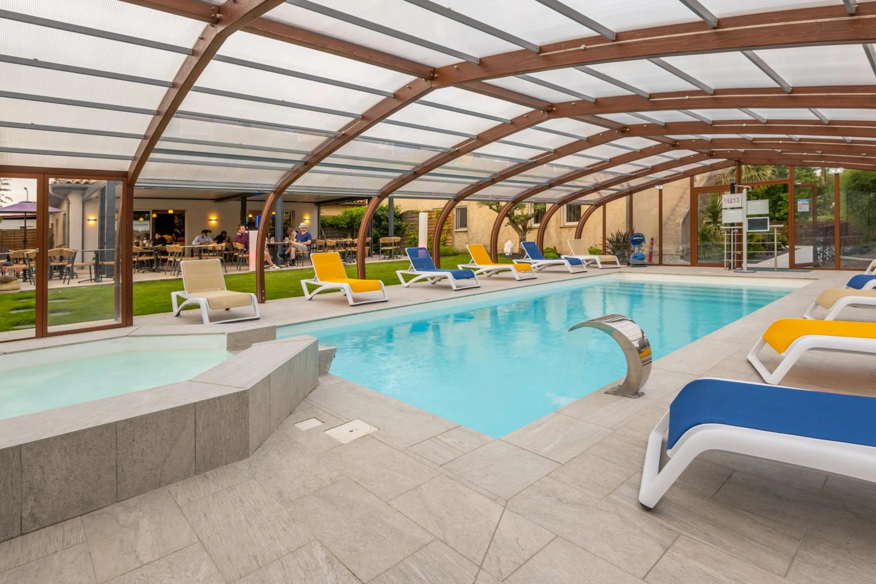 Swimming pool in LOGIS Hôtel Restaurant Le Clos Fleuri