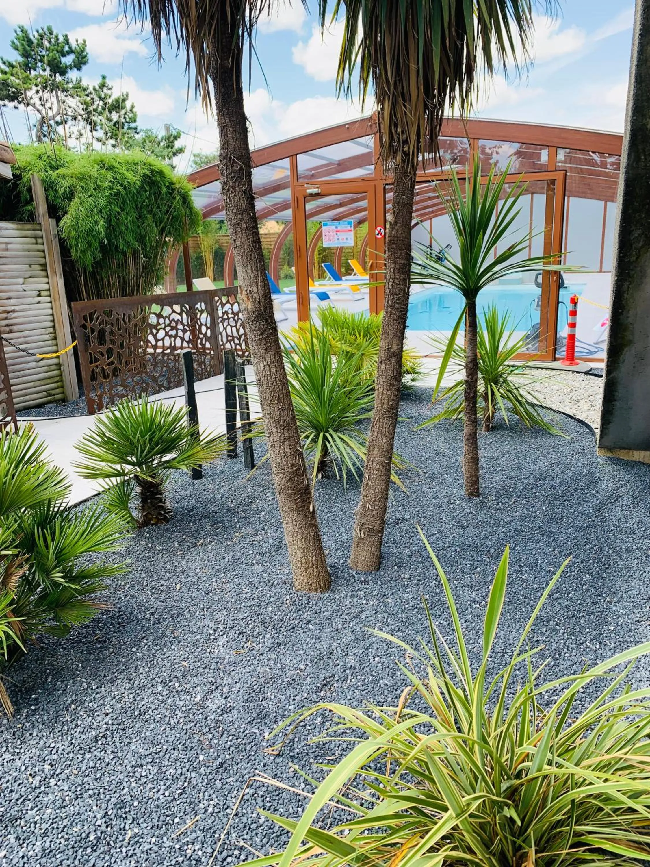 Swimming pool in LOGIS Hôtel Restaurant Le Clos Fleuri