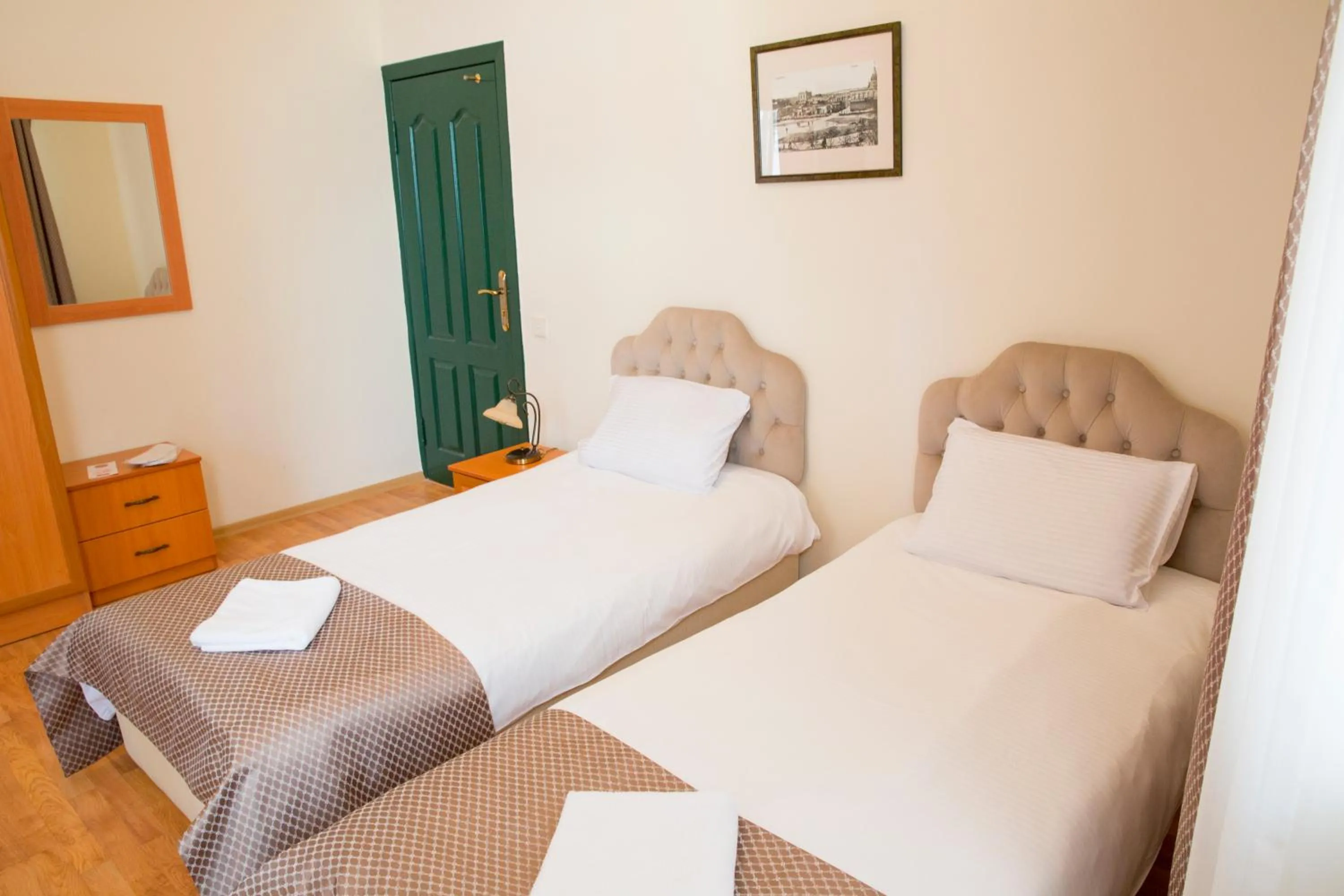 Bed in Old City Inn Hotel