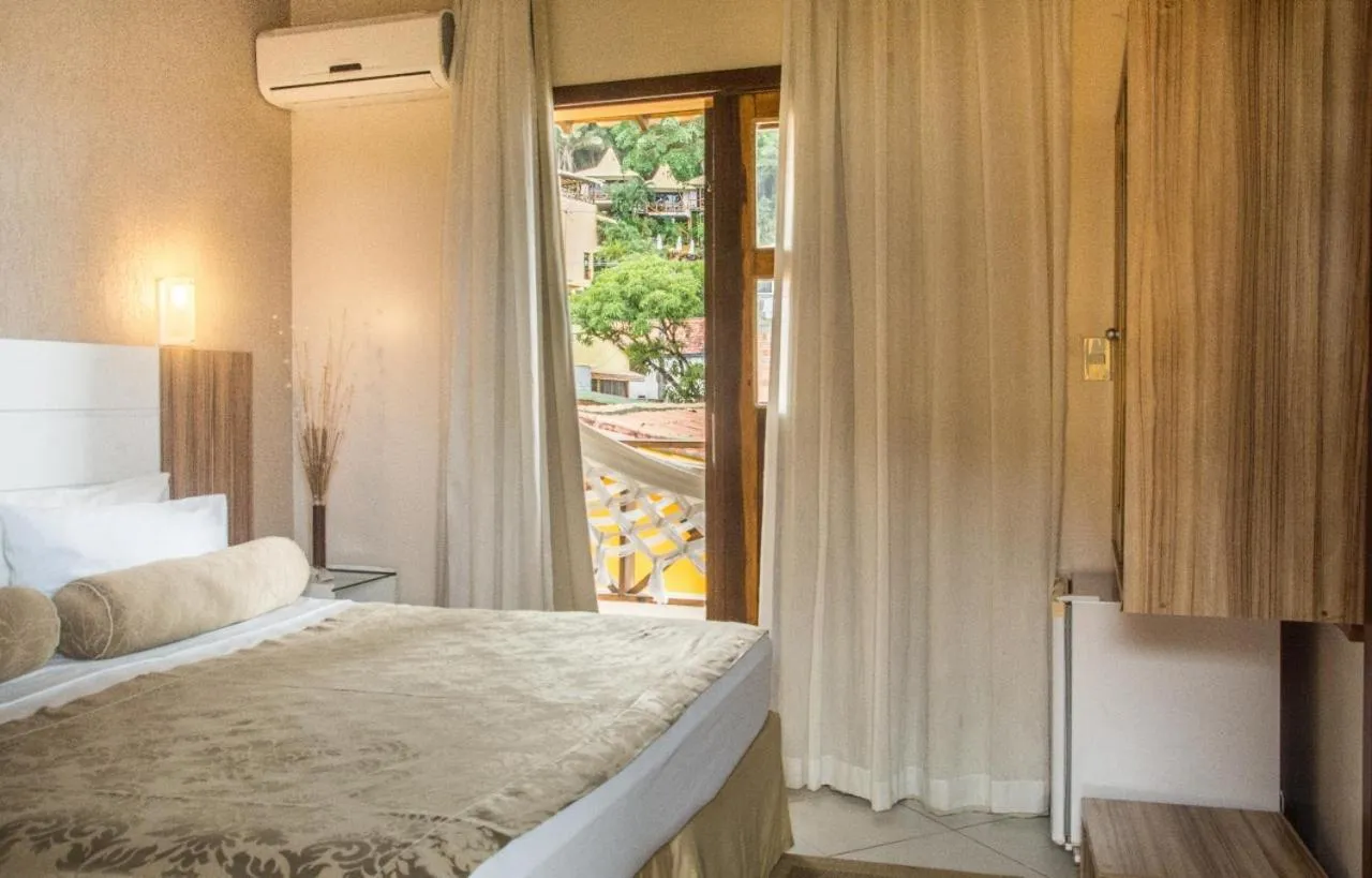 Bed in Pousada Pérola Do Morro