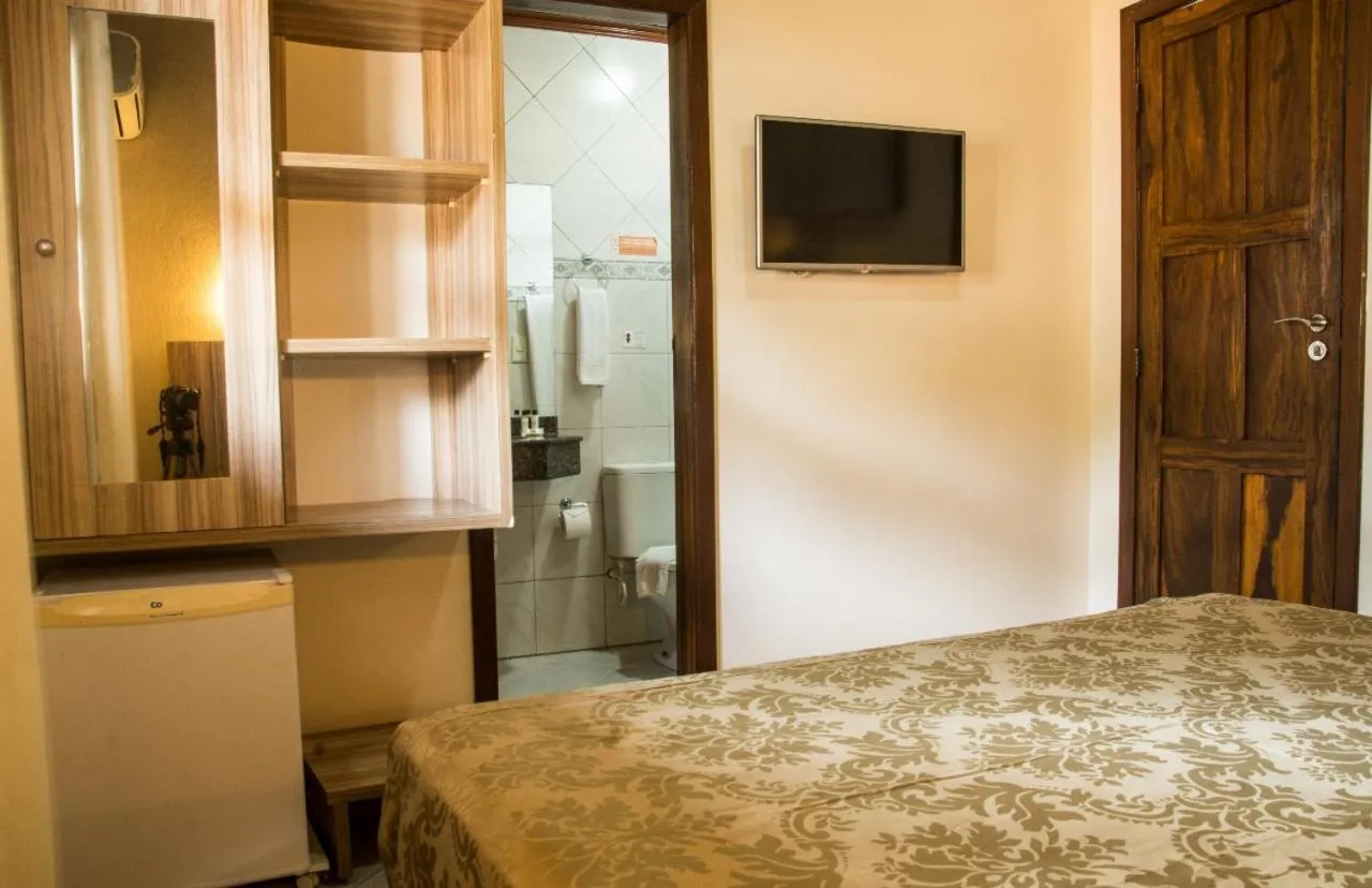 Bed in Pousada Pérola Do Morro