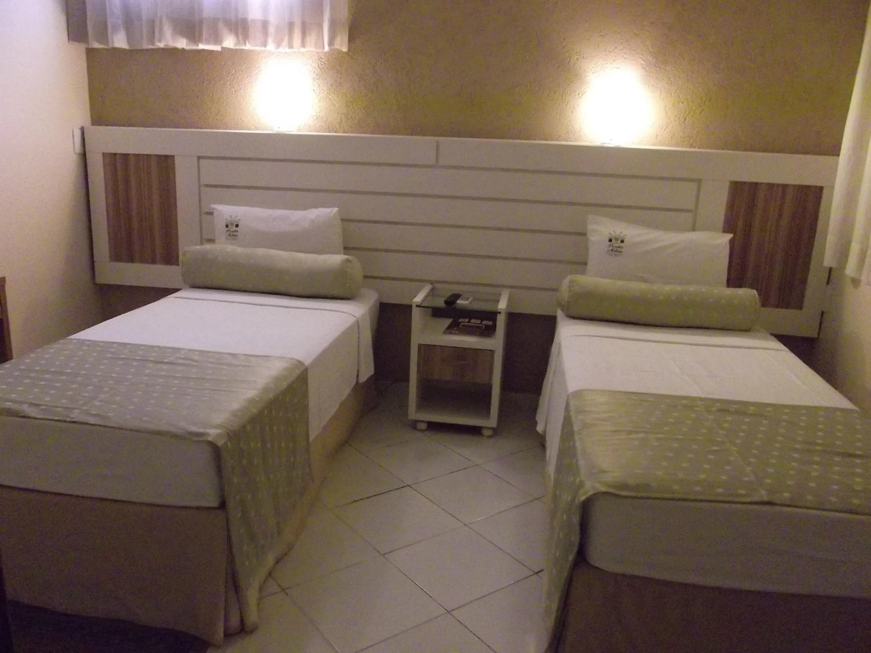 Bed in Pousada Pérola Do Morro