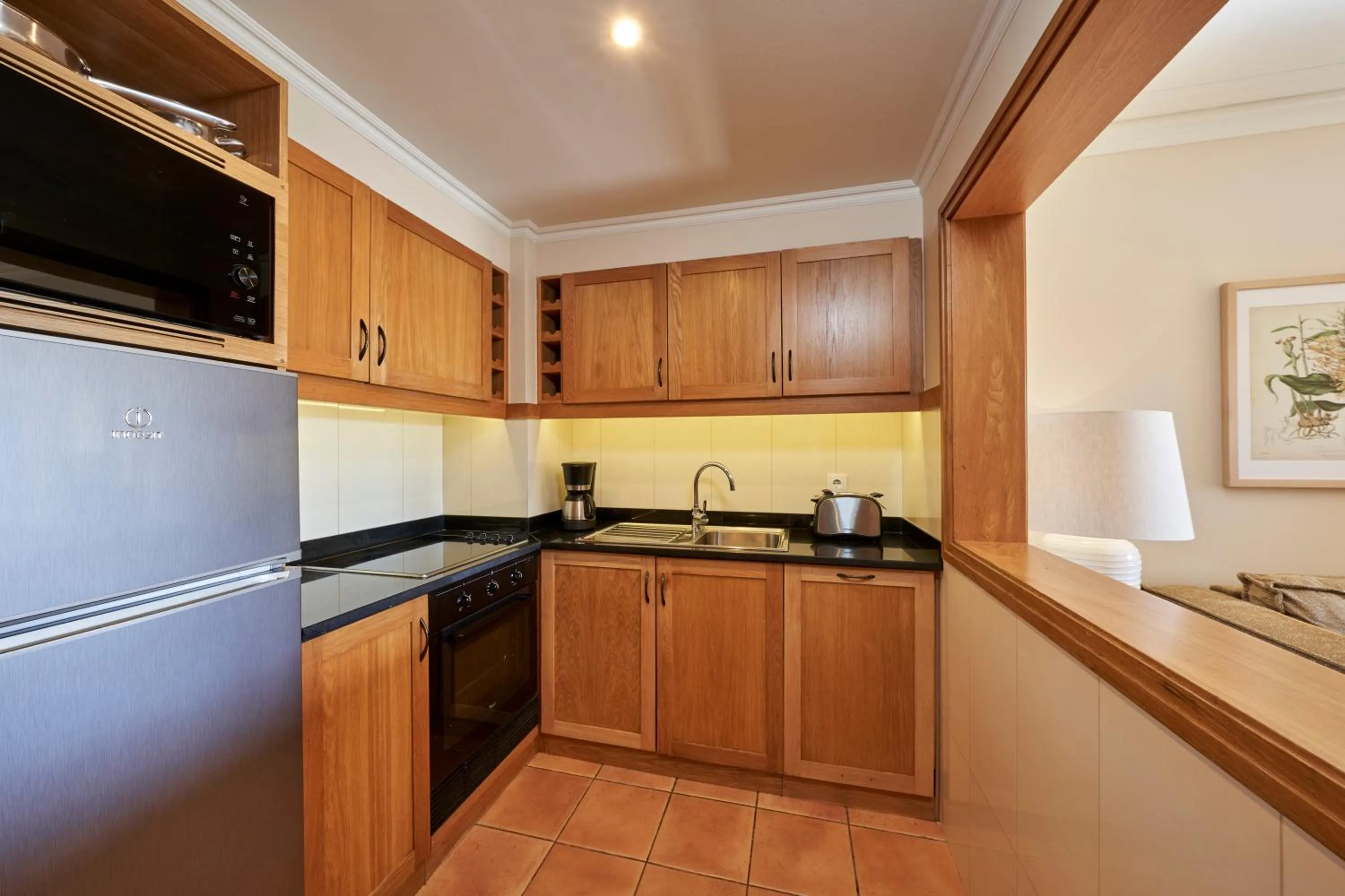 Kitchen or kitchenette in The Residence Porto Mare - PortoBay