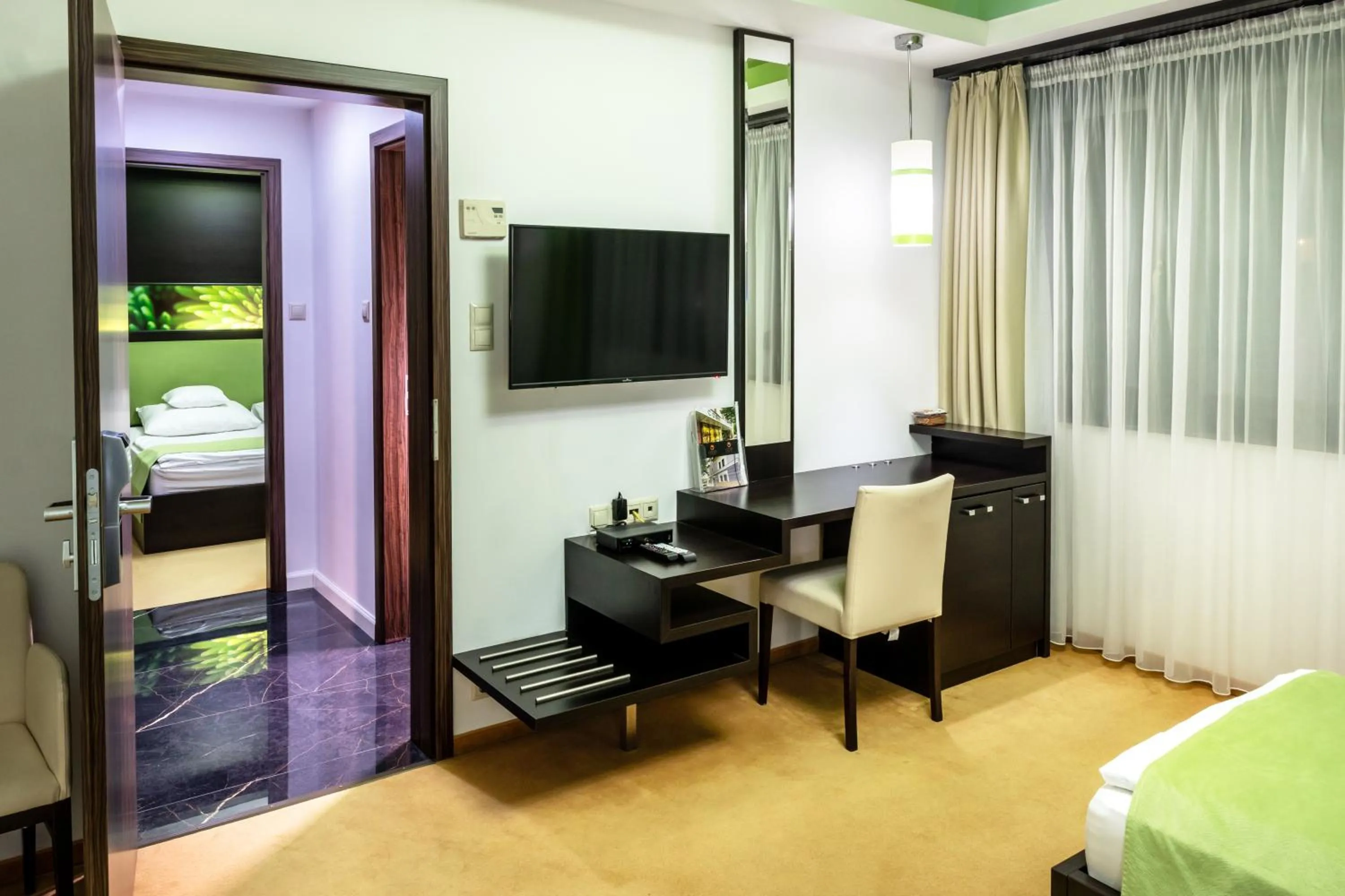 Communal lounge/ TV room, Bed in Corso Boutique Hotel