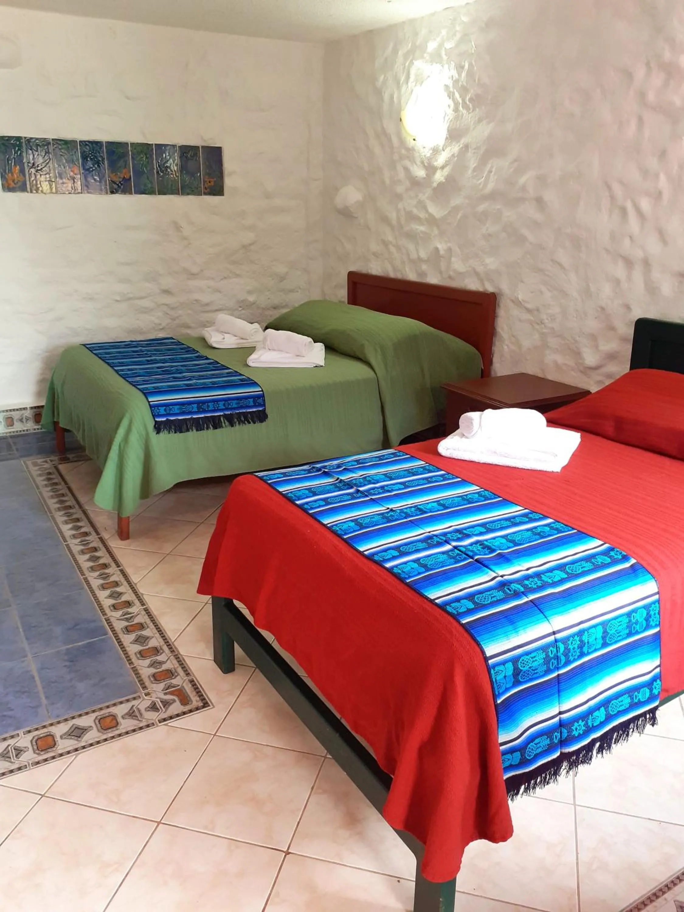 Bed in CasKaffeSu Hotel and Restaurant Mindo