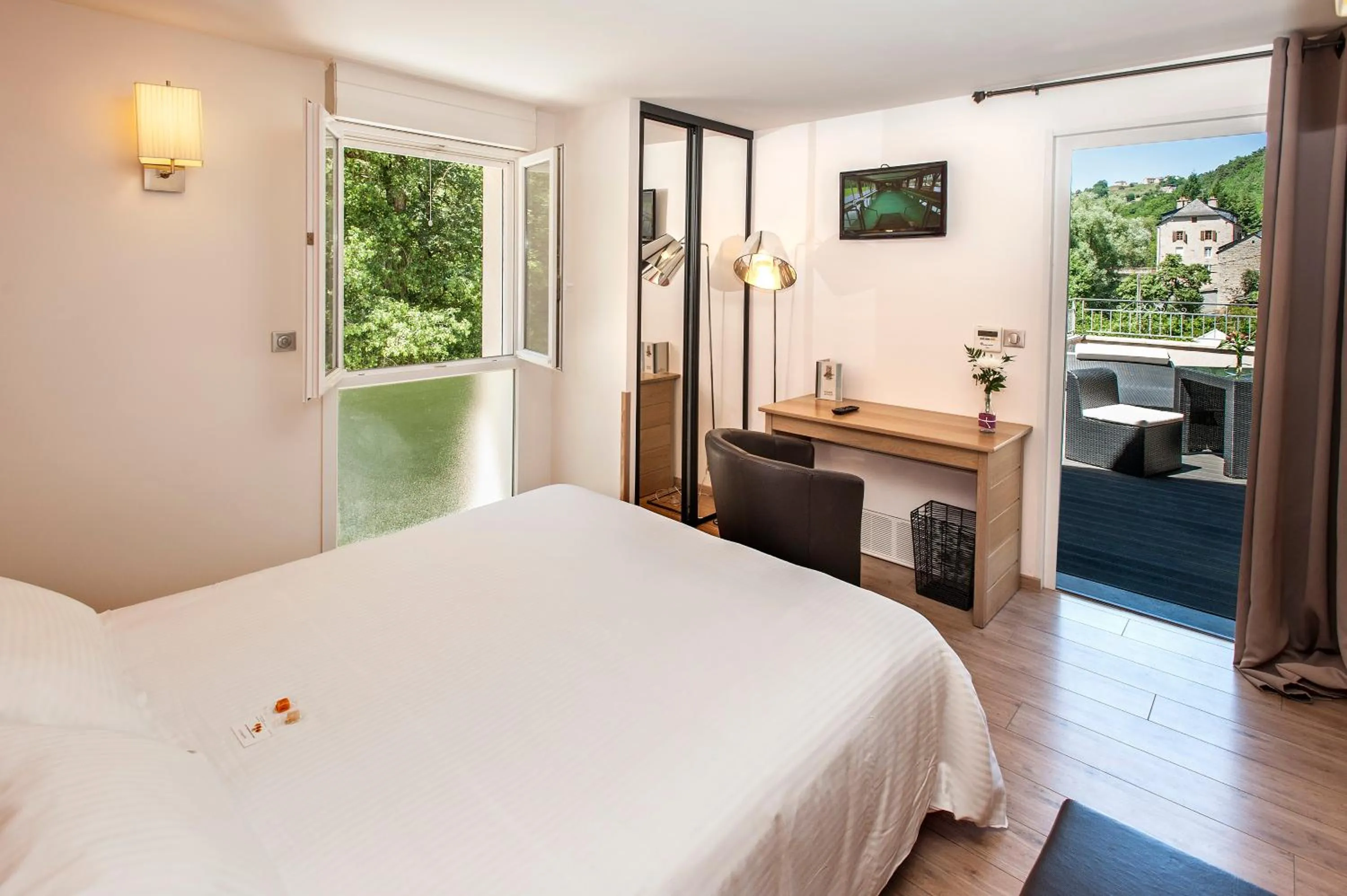 Photo of the whole room, Bed in Logis Hôtel Restaurant Les 2 Rives - A75, en bordure de rivière