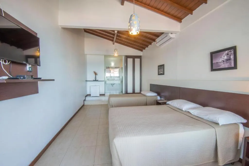 Bed in Pousada Ilha da Saudade