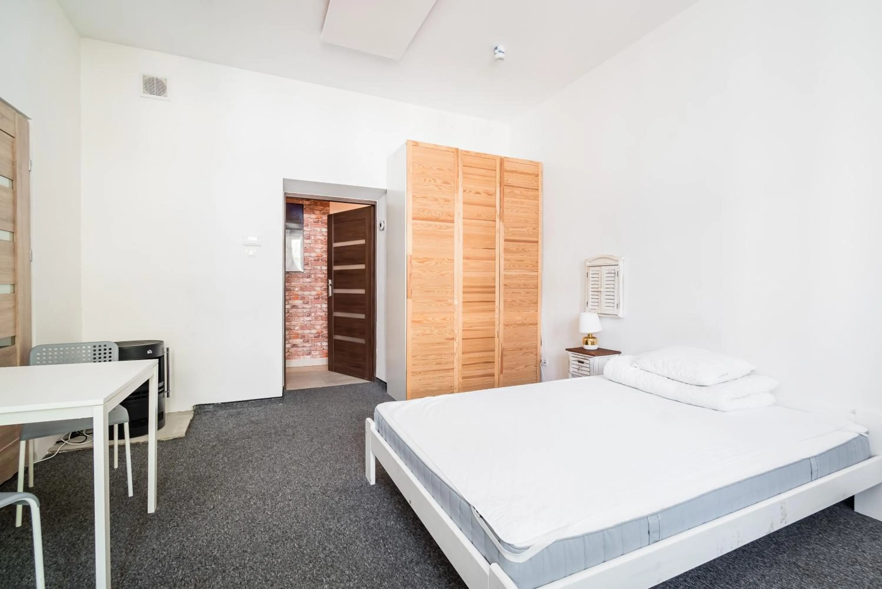 Photo of the whole room, Bed in Master Corner Apartment