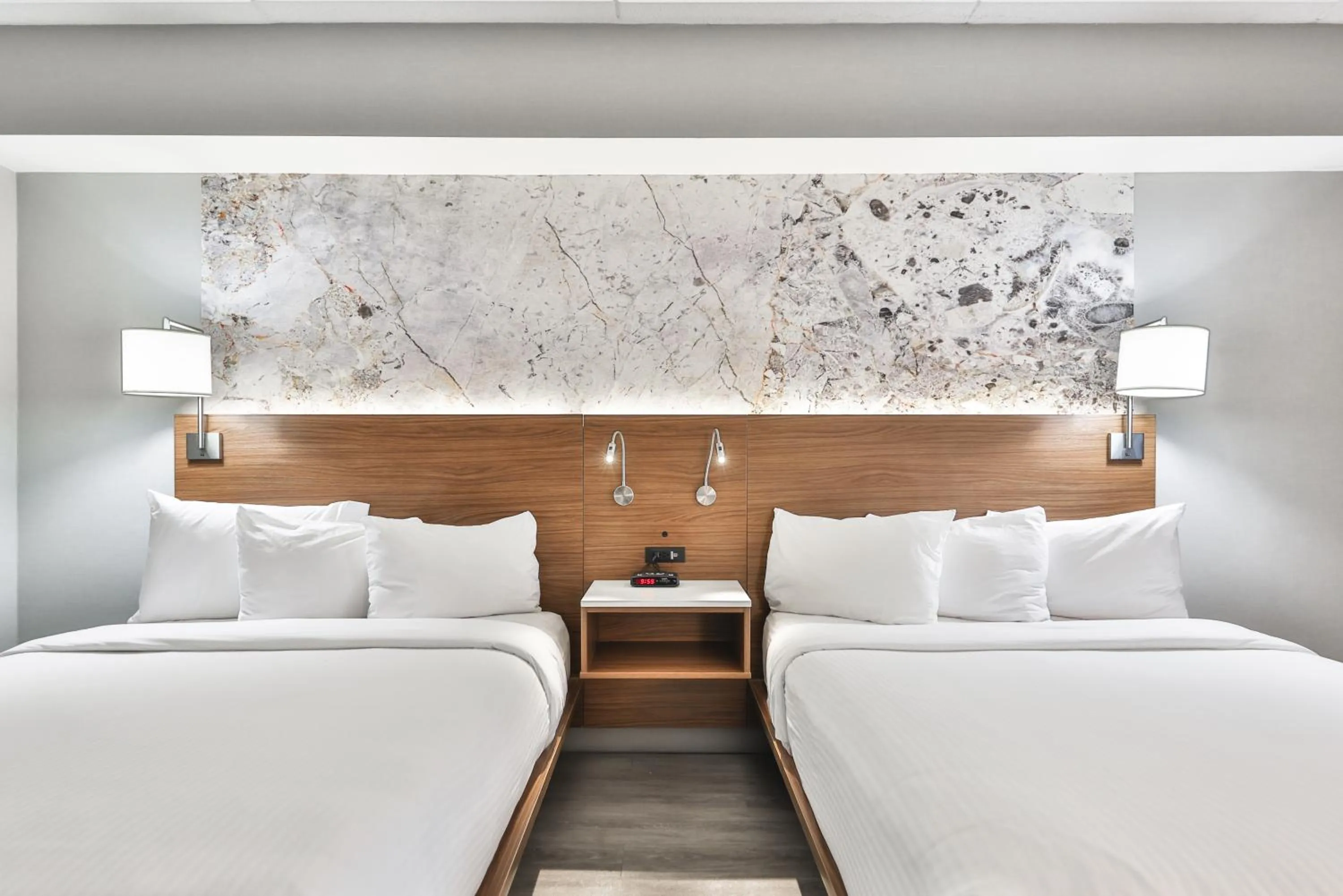 Bed in Admiral Inn Mississauga