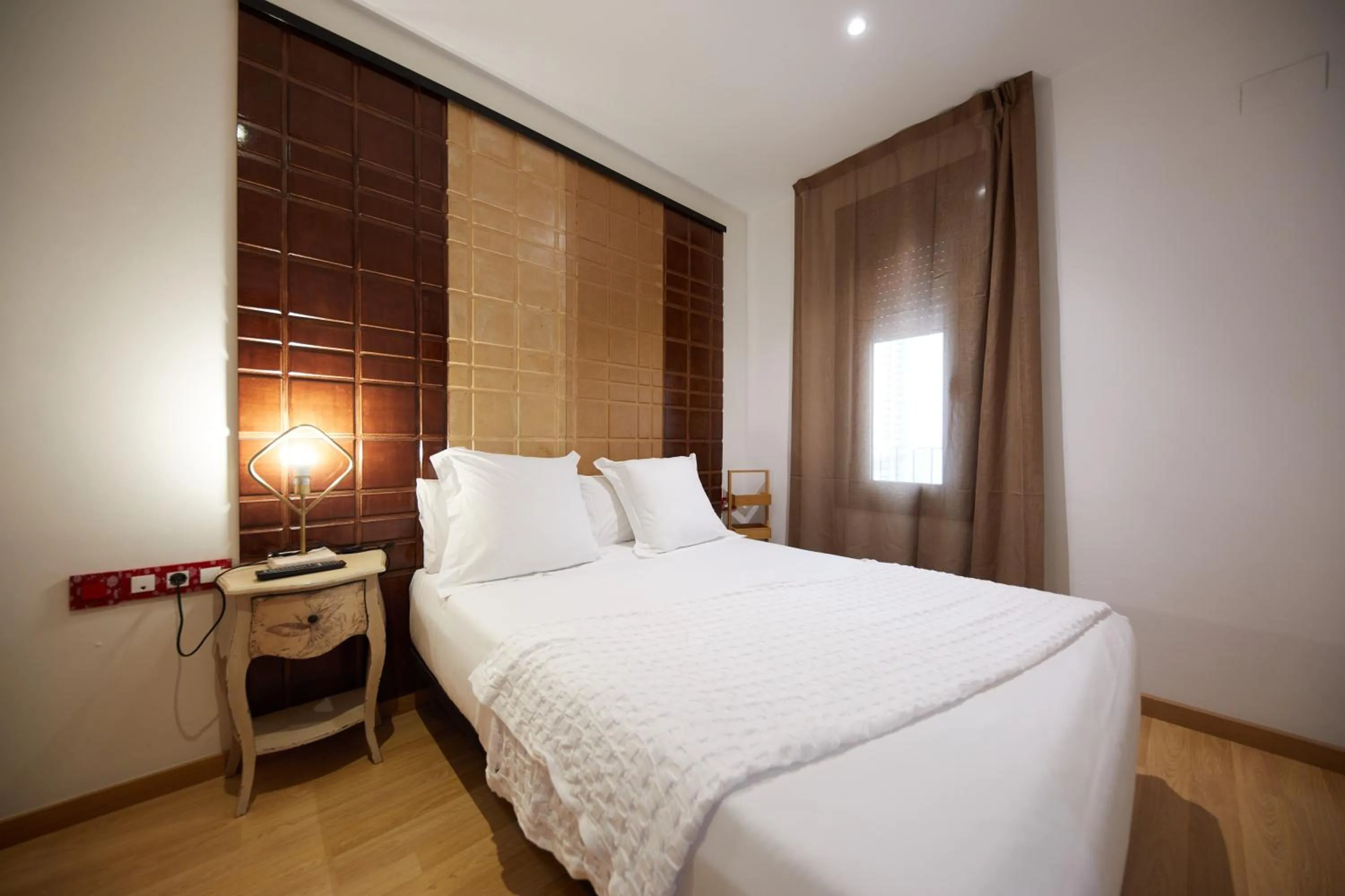 Bed in Apart-Suites Hostemplo