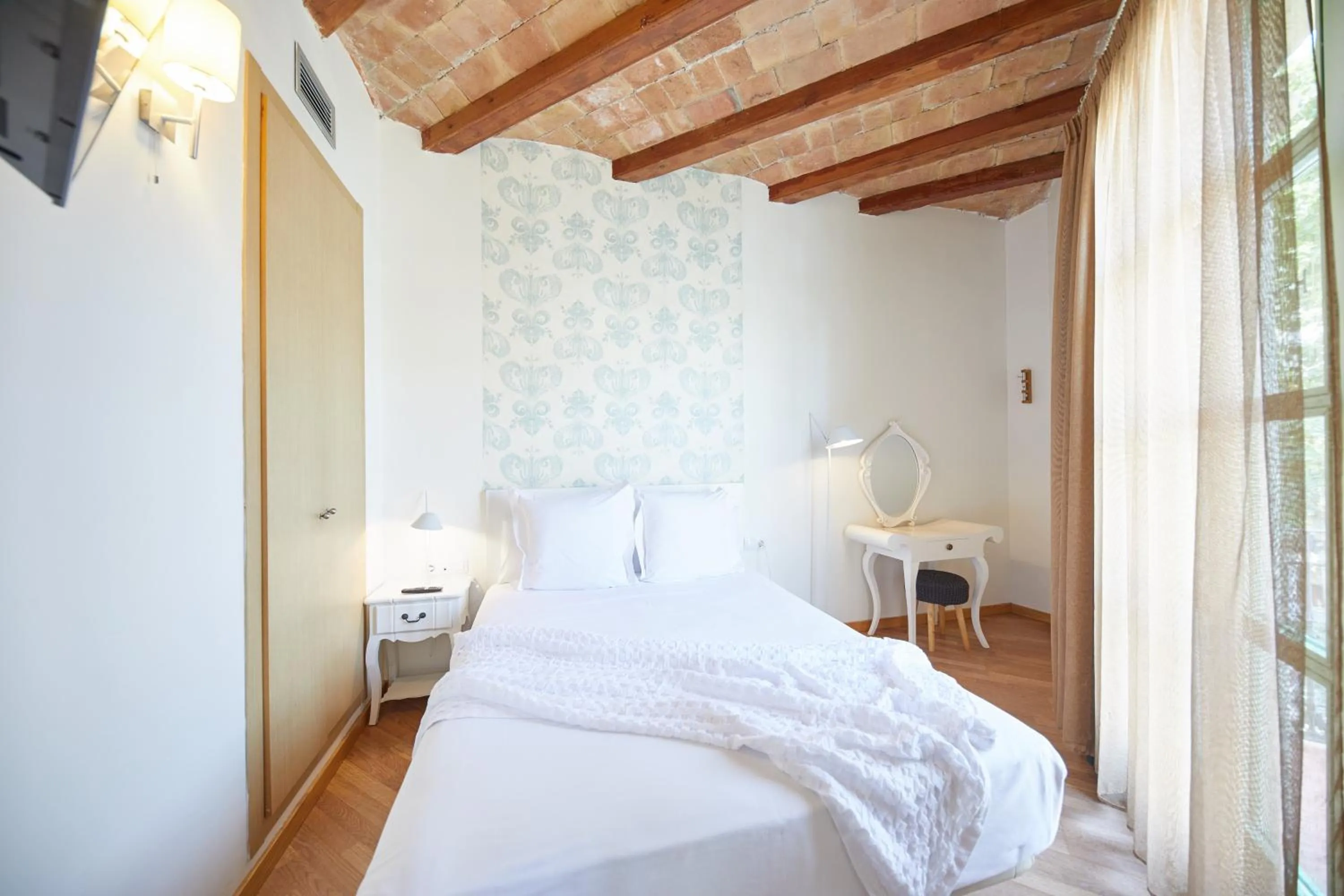 Bed in Apart-Suites Hostemplo