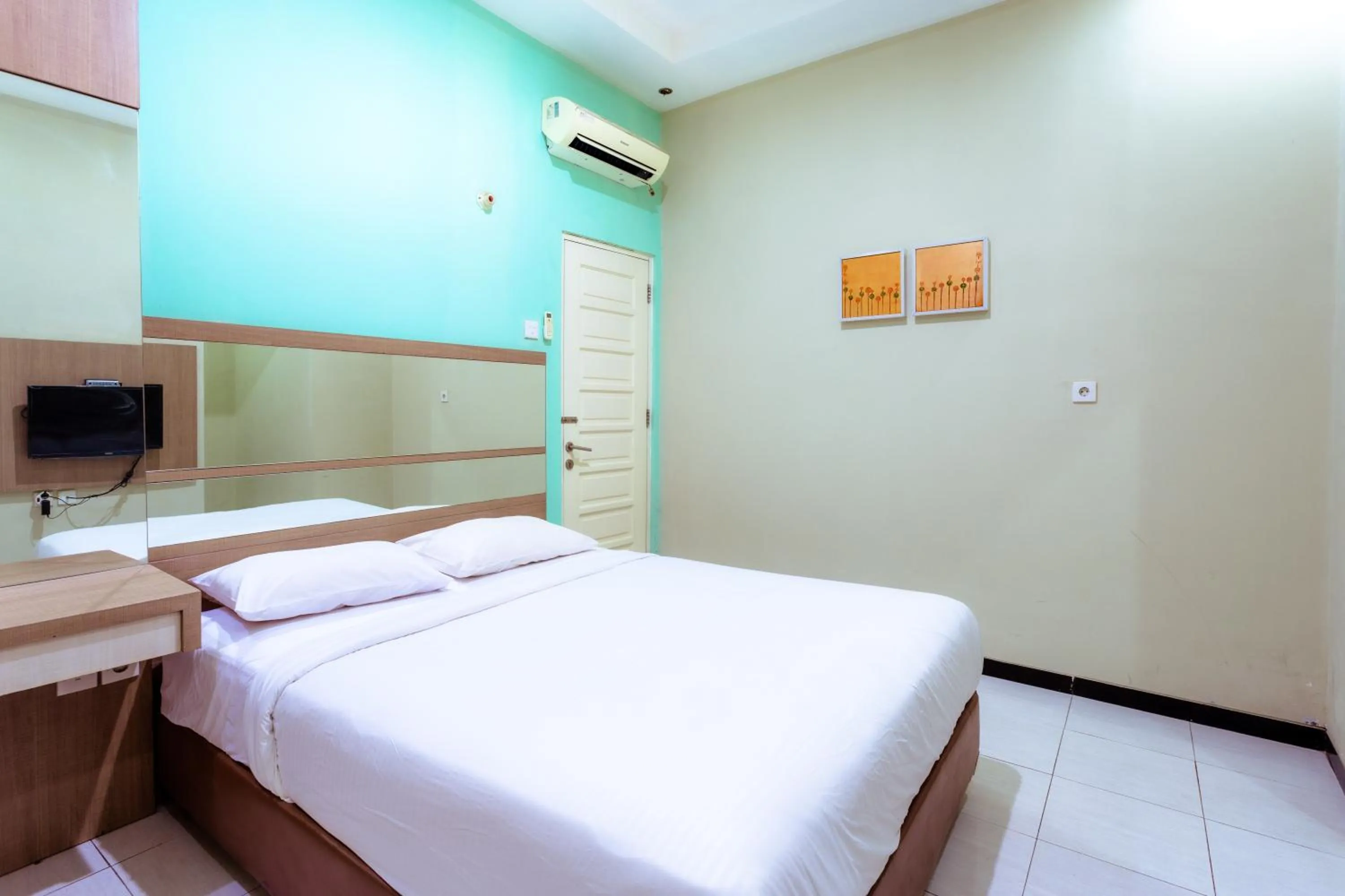Bed in Ardhya Guesthouse Syariah by ecommerceloka