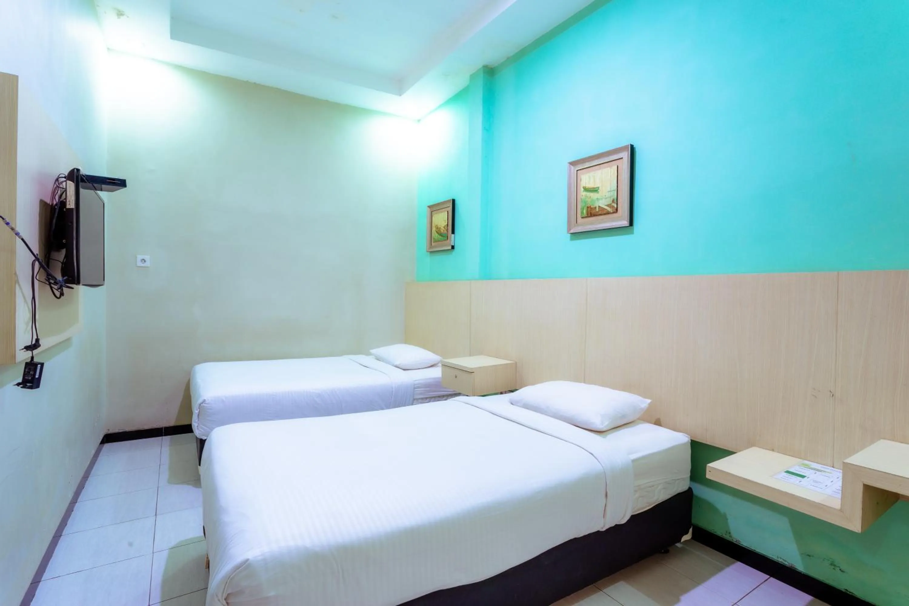 Bed in Ardhya Guesthouse Syariah by ecommerceloka